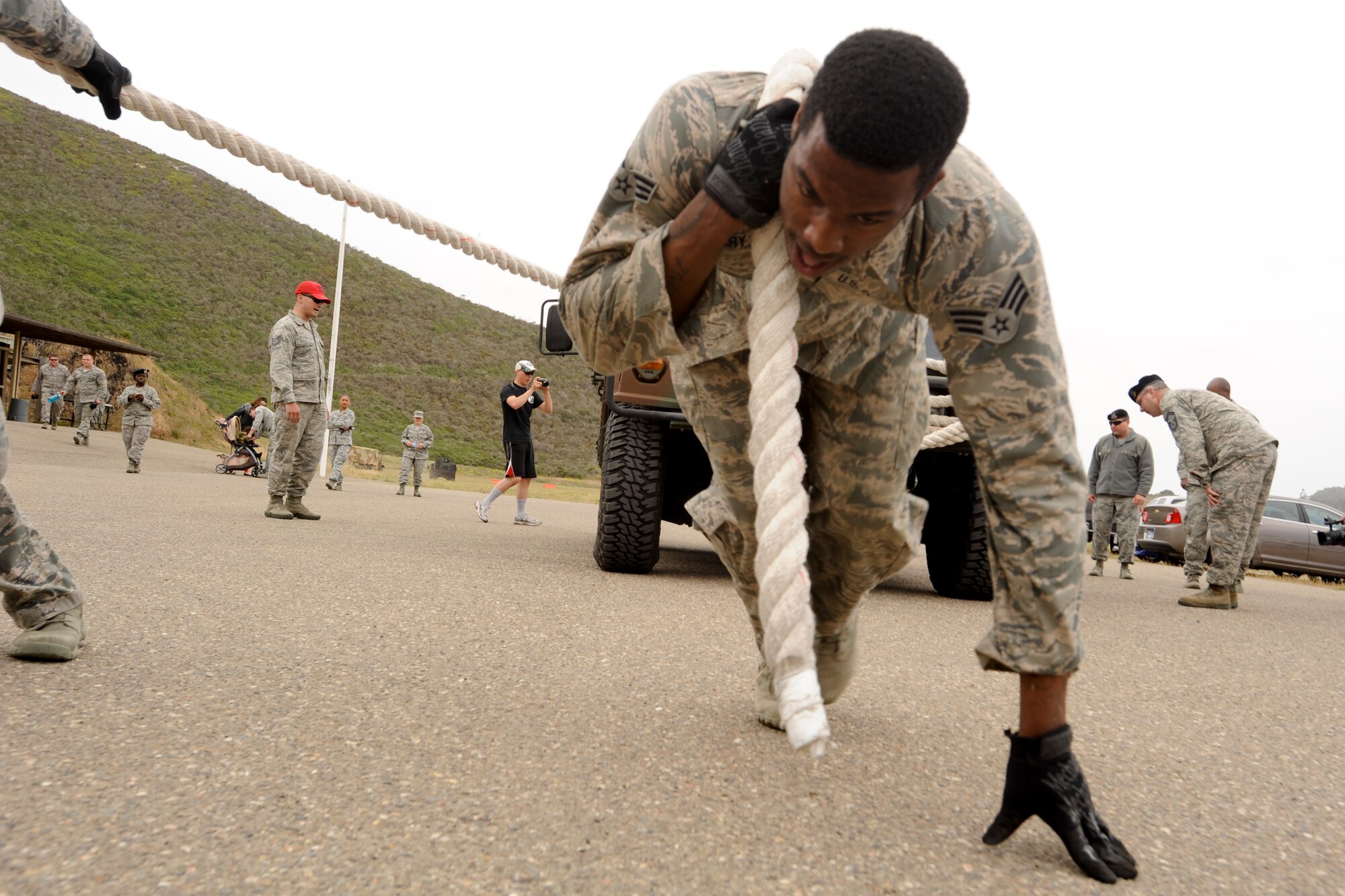 VANDENBERG AIR FORCE BASE, Calif. – Senior Airman Matthew Gary, a 30th Security Forces Squadron response force member, hauls a Humvee with the help of his team during a competition for National Police Week here Tuesday, May 14, 2013. The 30th Security Forces Squadron held this year’s West Coast Warrior Challenge Competition as part of their National Police Week ceremonies, meant to honor law enforcement officers who have lost their lives in the line of duty. (U.S. Air Force photo/Airman Yvonne Morales)