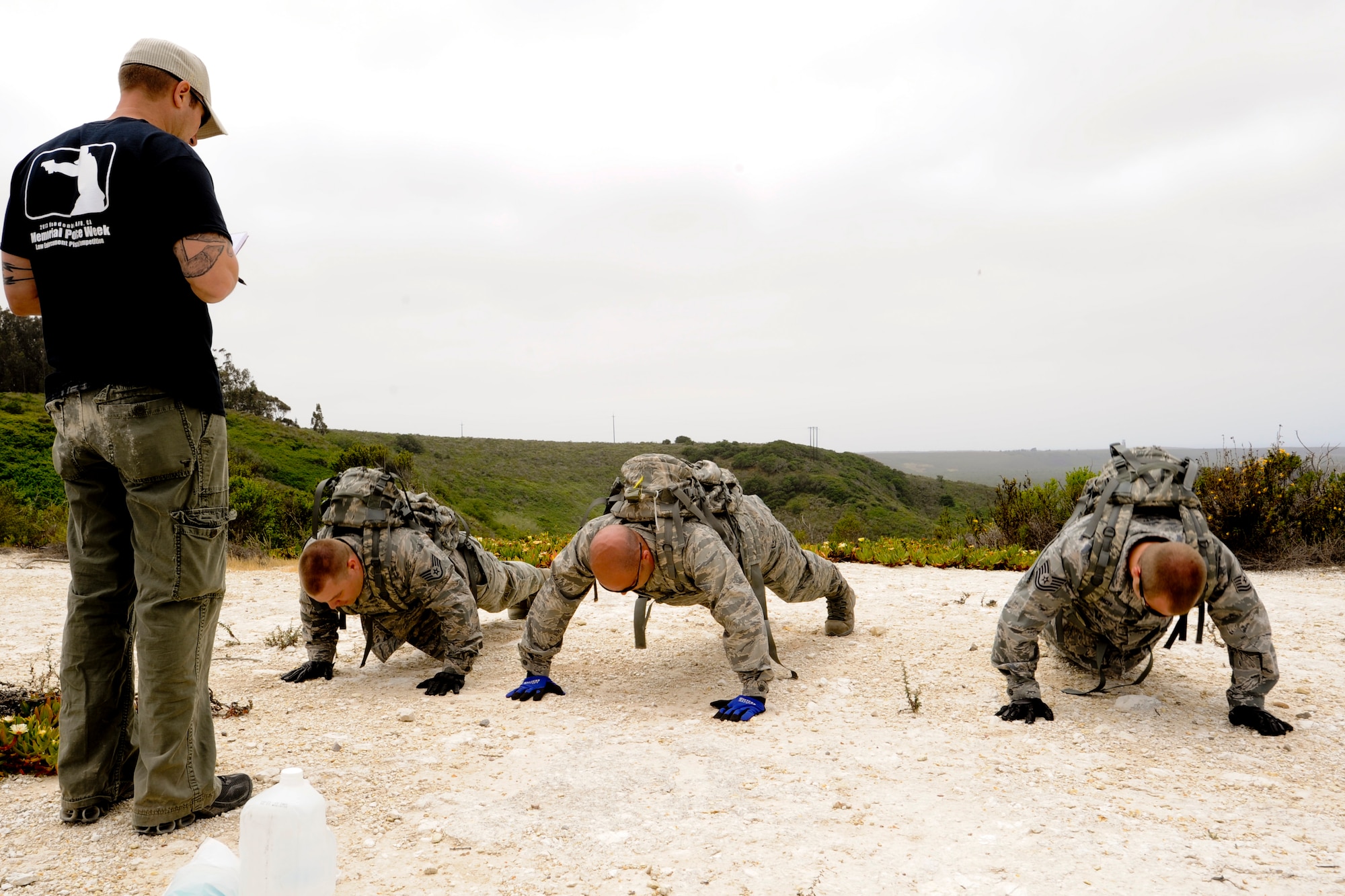 VANDENBERG AIR FORCE BASE, Calif. – Airmen perform pushups to total 100 as a team during a competition for National Police Week here Tuesday, May 14, 2013. The 30th Security Forces Squadron held this year’s West Coast Warrior Challenge Competition as part of their National Police Week ceremonies, meant to honor law enforcement officers who have lost their lives in the line of duty. (U.S. Air Force photo/Airman Yvonne Morales)