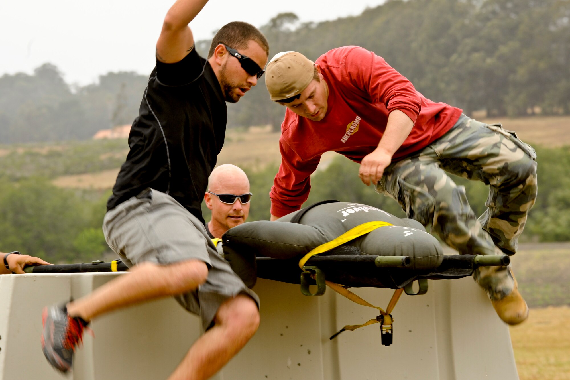 VANDENBERG AIR FORCE BASE, Calif. – The 30th Space Communications Squadron team jumps over obstacles during a competition for National Police Week here Tuesday, May 14, 2013. The 30th Security Forces Squadron held this year’s West Coast Warrior Challenge Competition as part of their National Police Week ceremonies, meant to honor law enforcement officers who have lost their lives in the line of duty. (U.S. Air Force photo/Airman Yvonne Morales)