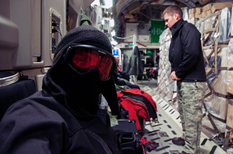 Staff Sgts. Robert Tingle (left) and Erik Welp, 62nd Aircraft Maintenance Squadron flying crew chiefs, along with the aircrew begin to don cold weather gear May 10, 2013 in preparation for a decent into Pegasus Field at McMurdo Station, Antarctica. The temperatures at Antarctica were at approximately minus 40 degrees Fahrenheit. (U.S. Air Force photo/Staff Sgt. Robert Tingle)