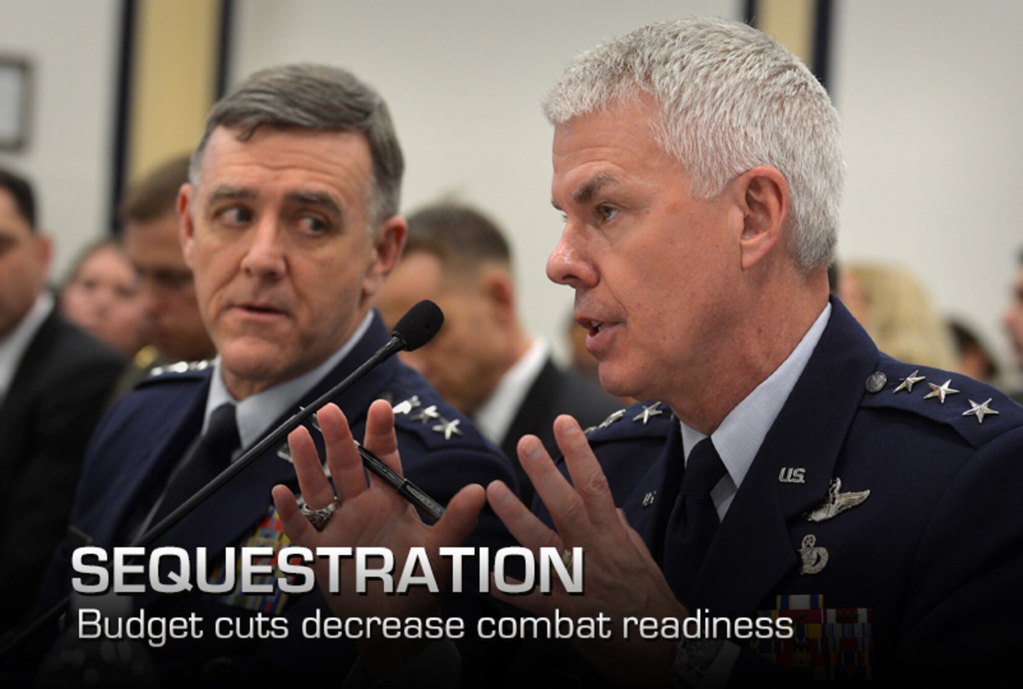 Air Force Lt. Gen. Burton Field looks on while U.S. Air Force Lt. Gen. Charles Davis answers a question posed to him about combat aviation programs being budgeted for fiscal year 2014 during a hearing of the House Armed Services Committee's Tactical Air and Land Forces Subcommittee on Capitol Hill, Washington, D.C., April 17, 2013. Davis is the Military Deputy, Office of the Assistant Secretary of the Air Force for Acquisition. He is responsible for research and development, test, production and modernization of Air Force programs. Field is deputy chief of staff for operations, plans and requirements and also serves as the Air Force operations deputy to the Joint Chiefs of Staff. . (U.S. Air Force photo/Jim Varhegyi)