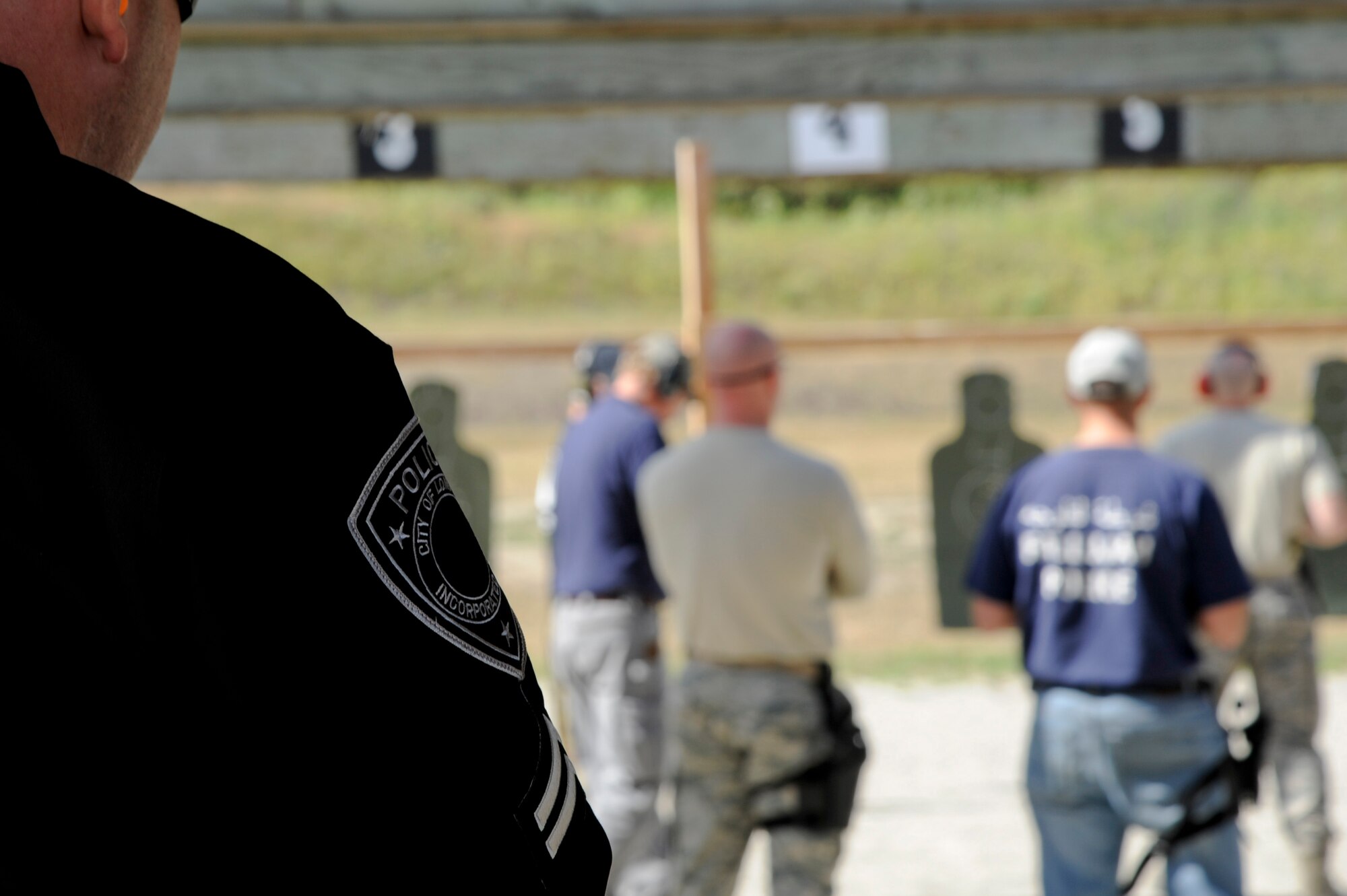 VANDENBERG AIR FORCE BASE, Calif. – A Lompoc Police Department member views a quick draw portion of the Law Enforcement Pistol Shoot competition at the Combat Arms Training and Maintenance shooting range here Tuesday, May 14, 2013. The LEPS is a friendly competition between the law enforcement agencies of Santa Barbara County hosted by the 30th SFS to commemorate National Police Week. (U.S. Air Force photo/Senior Airman Lael Huss)