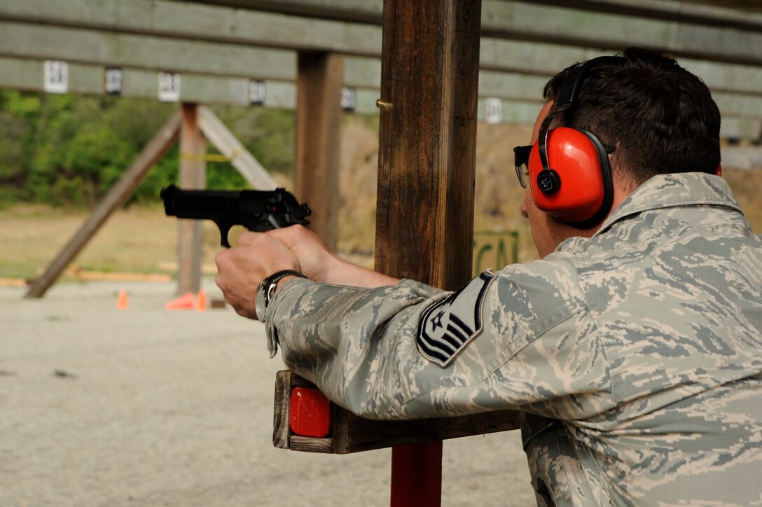 VANDENBERG AIR FORCE BASE, Calif. – Master Sgt. Thomas Lepetri, 30th Security Forces Squadron patrolman, completes a shot at a hanging target during a Law Enforcement Pistol Shoot completion at the Combat Arms Training and Maintenance shooting range here Tuesday, May 14, 2013. The LEPS is a friendly competition between the law enforcement agencies of Santa Barbara County hosted by the 30th SFS to commemorate National Police Week. (U.S. Air Force photo/Senior Airman Lael Huss)