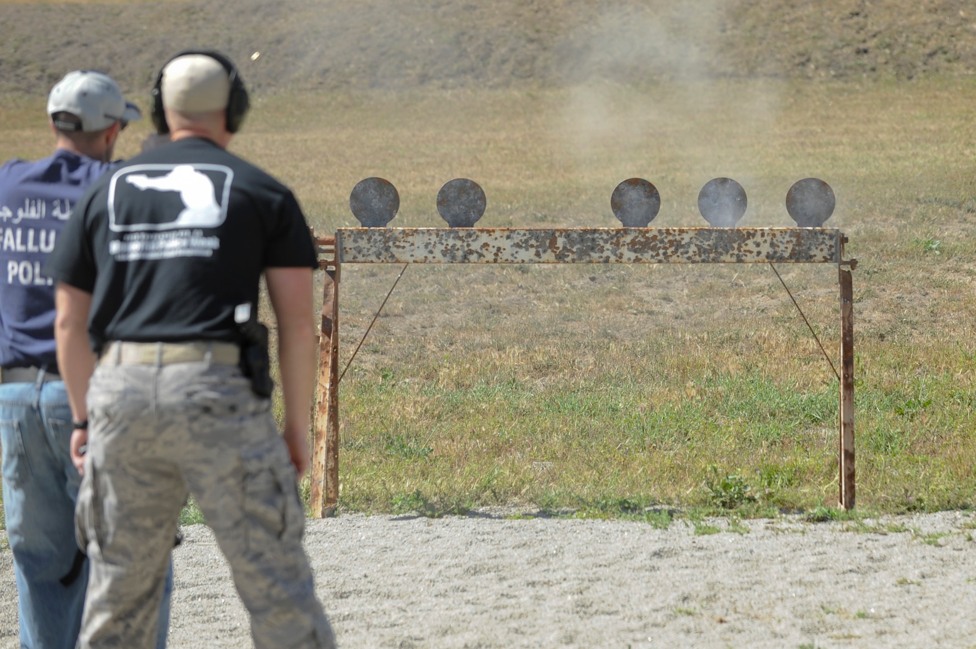 VANDENBERG AIR FORCE BASE, Calif. – A 30th Security Forces Squadron member shoots at 6 metal disks during a Law Enforcement Pistol Shoot competition at the Combat Arms Training and Maintenance shooting range here Tuesday, May 14, 2013. The LEPS is a friendly competition between the law enforcement agencies of Santa Barbara County hosted by the 30th SFS to commemorate National Police Week. (U.S. Air Force photo/Senior Airman Lael Huss)