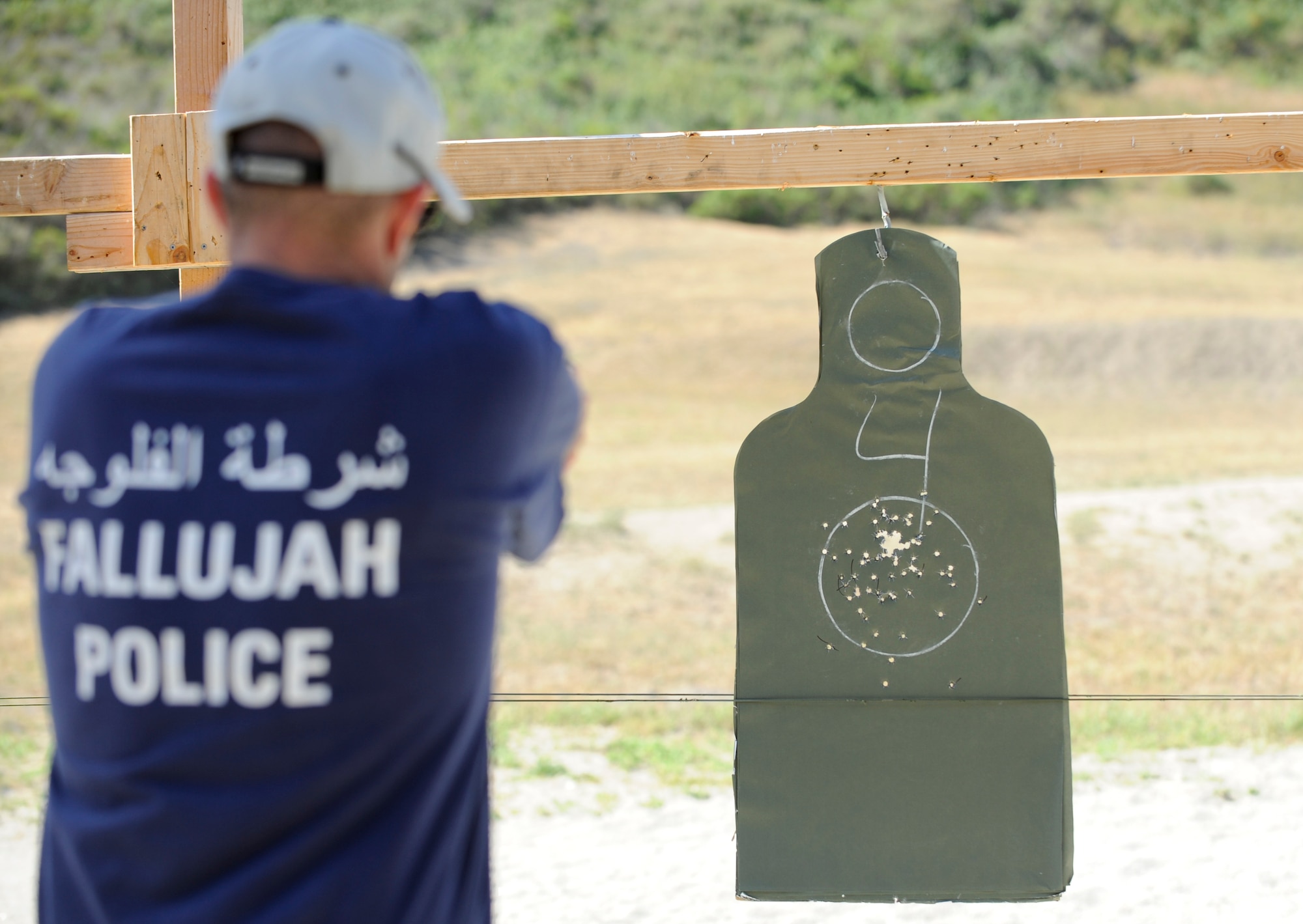 VANDENBERG AIR FORCE BASE, Calif. – A 30th Security Forces Squadron member shoots at a target during a Law Enforcement Pistol Shoot competition at the Combat Arms Training and Maintenance shooting range here Tuesday, May 14, 2013. The LEPS is a friendly competition between the law enforcement agencies of Santa Barbara County hosted by the 30th SFS to commemorate National Police Week. (U.S. Air Force photo/Senior Airman Lael Huss)