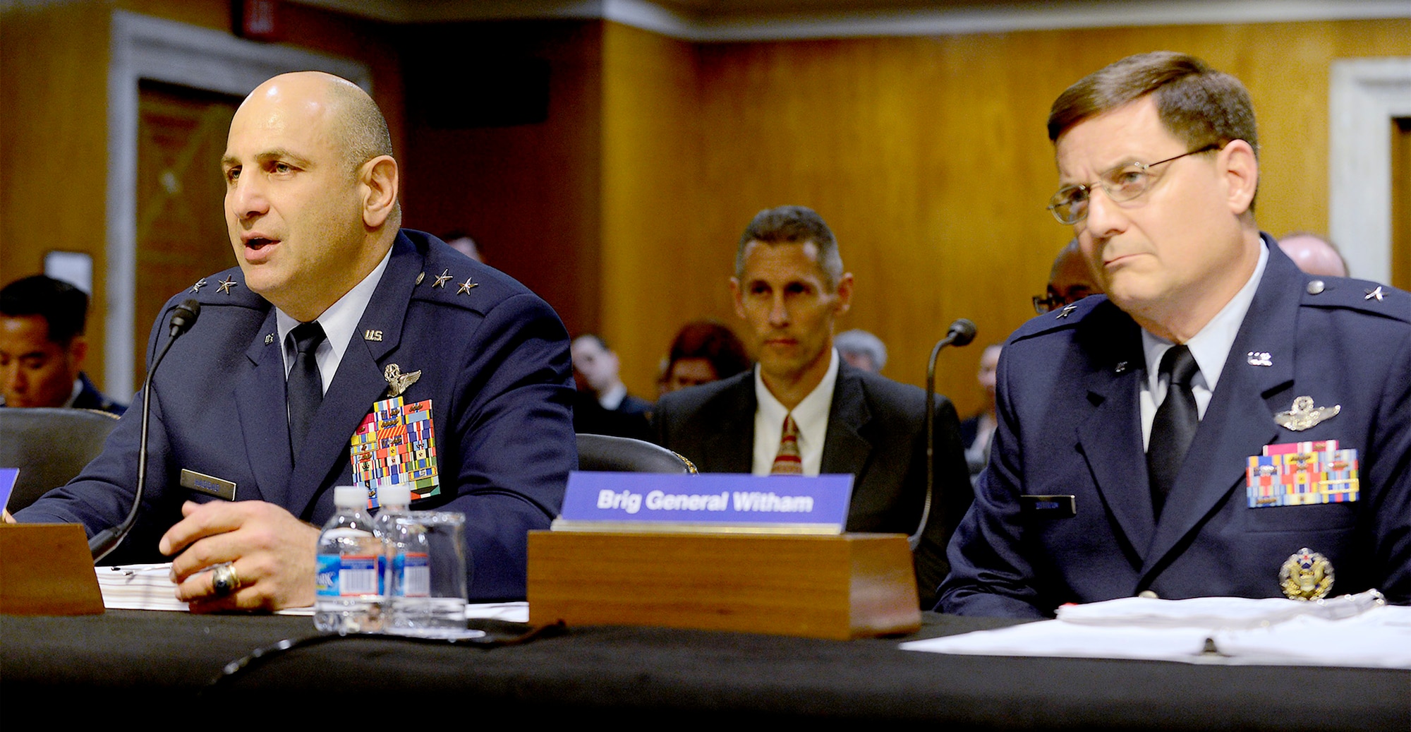 Maj. Gen. Richard S. Haddad, deputy to the chief of staff of Air Force
Reserves (left), discusses the proposed FY14 budget of the Air Force Reserve
with the U.S. Senate Appropriations Committee, Subcommittee on Military
Construction, Veterans Affairs, and Related Agencies, on Capitol Hill, May 15. Also shown is Brig. Gen. James C. "JC" Witham, the deputy director of the Air National Guard.  Senior leaders from the Air Force's active, reserve and guard programs provided statements and answered questions regarding the estimates for next year's plans which include three Air Force Reserve construction projects.  (U.S. Air Force photo/Scott M. Ash)
