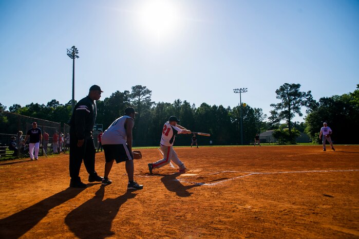 A 437th Aircraft Maintenance Squadron batter makes contact with a pitch during the 2013 Intramural Softball Season Opener May 14, 2013, at Joint Base Charleston – Air Base, S.C. The 437th AMXS team defeated the 628th Security Forces Squadron 15 – 7. (U.S. Air Force photo/Senior Airman George Goslin)