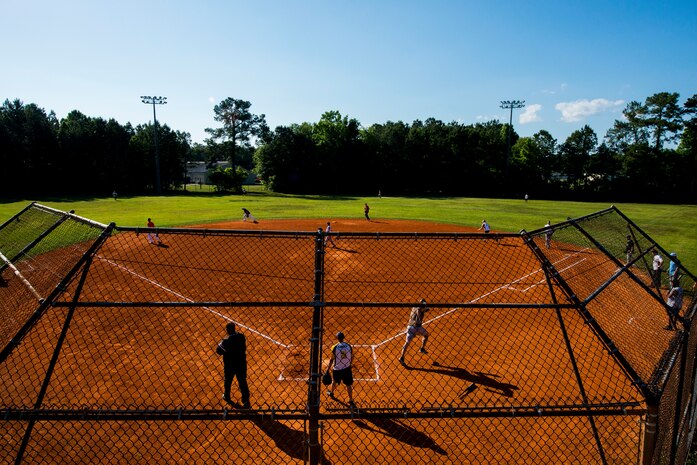 The 628th Security Forces Squadron team competes against the 437th Aircraft Maintenance Squadron team in the 2013 Intramural Softball Season Opener May 14, 2013, at Joint Base Charleston – Air Base, S.C. The 437th AMXS team defeated the 628th SFS 15 – 7. (U.S. Air Force photo/Senior Airman George Goslin)