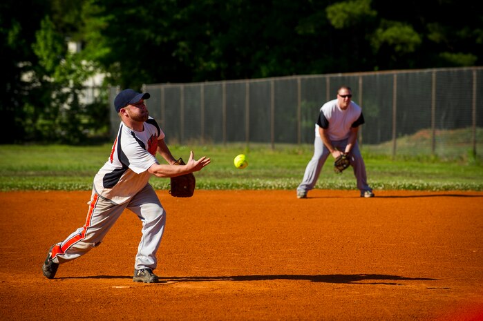 A 437th Aircraft Maintenance Squadron pitcher delivers a pitch during the 2013 Intramural Softball Season Opener May 14, 2013, at Joint Base Charleston – Air Base, S.C. The 437th AMXS team defeated the 628th Security Forces Squadron 15 – 7. (U.S. Air Force photo/Senior Airman George Goslin)