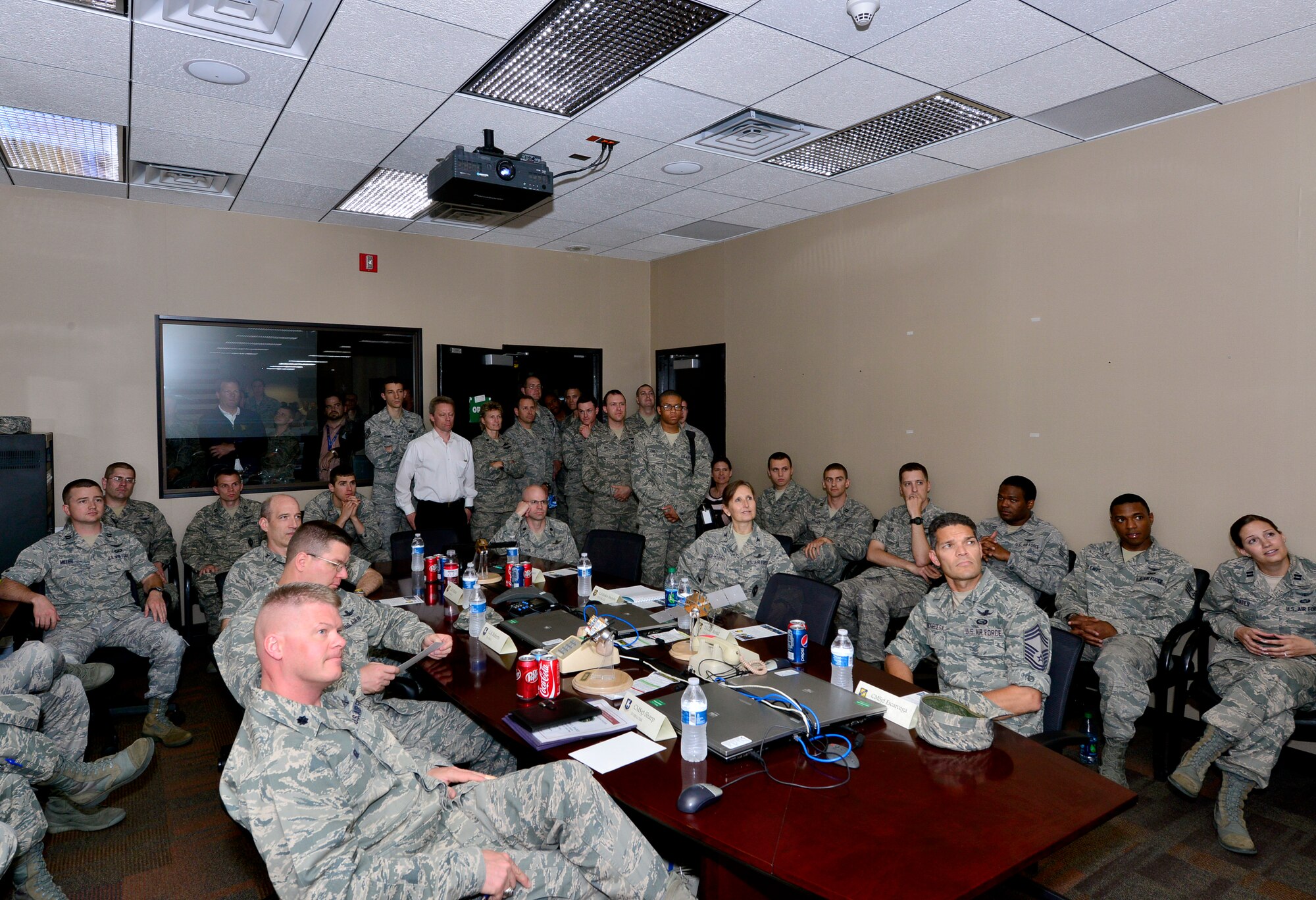Schriever personnel watch the successul launch of the fourth GPS IIF satellite, Space Vehicle Number 66 May 15 from Cape Canaveral Air Force Station, Fla. The new capabilities of the IIF satellites will provide greater navigational accuracy through improvements in atomic clock technology; a more robust signal for commercial aviation and safety-of-life applications, known as the new third civil signal (L5); and a 12-year design life providing long-term service. (U.S. Air Force photo/Bill Evans)