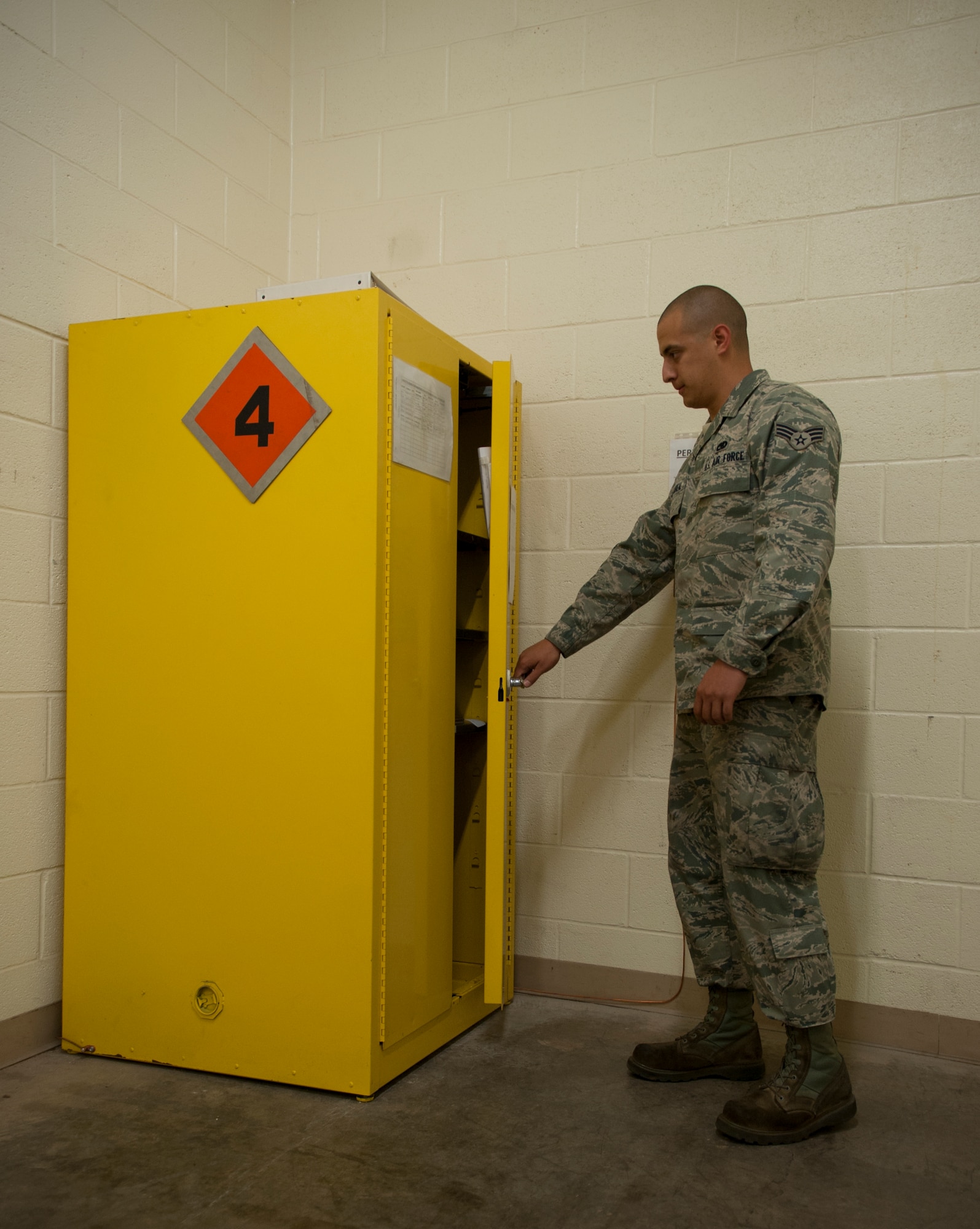 Senior Airman John Villarreal, 7th Aircraft Maintenance Squadron, goes through safety procedures before handling squibs, an electrically fired explosive, May 14, 2013, at Dyess Air Force Base, Texas. The 7th AMXS's electrical and environmental shop was recently awarded the 12th Air Force Unit Safety Award of Distinction due to the combined efforts of their unit weapons safety representatives. Senior Airmen John Villarreal, Jacob Gillen and Andrew Smith, 7th AMXS, implemented a safer way to handle squibs. In doing so, they improved workplace safety for all personnel assigned to the electrical and environmental shop. (U.S. Air Force photo by Senior Airman Jonathan Stefanko/Released)