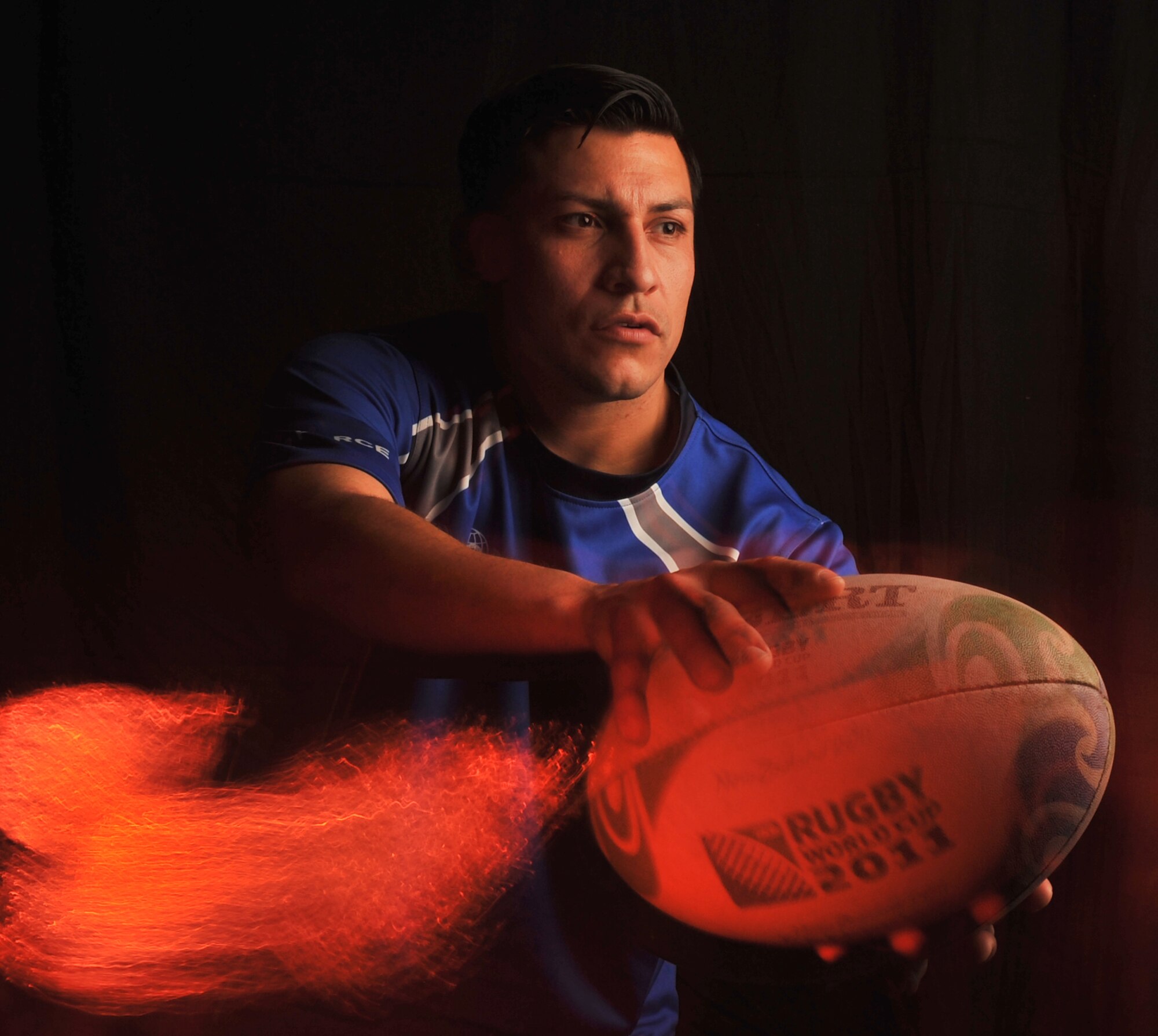 Staff Sgt. Joseph Senteno, 2nd Comptroller Squadron, passes a rugby ball on Barksdale Air Force Base, La., May 10, 2013. Senteno was chosen to represent the Air Force in rugby at the Military Memorial Cup, which is a sports competition where the best athletes from each branch compete. During the competition, Senteno will be given the opportunity to compete for a position on the U.S. Olympic team. (U.S. Air Force photo/Airman 1st Class Benjamin Gonsier) 
