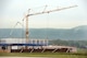 A crane operator moves equipment into place during construction of the Aircraft Ground Equipment Flight Maintenance Complex, May 16, 2013, Ramstein Air Base, Germany. Once built, the facility will be used for maintenance on aircraft equipment. (U.S. Air Force photo/Senior Airman Caitlin O’Neil-McKeown) 