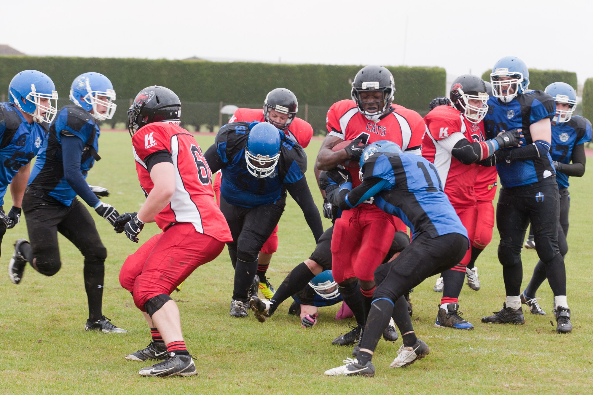 RAF ALCONBURY, United Kingdom – Samuel Anwti, Cambridgeshire Cats running back, is stopped by Wayne Gumbs , Peterborough Saxons defensive back, after gaining six yards during the first quarter of the first ever Bob "The Dog" Shaw Classic May 12 at the RAF Alconbury football field. These two teams have a history of playing each other for years and consider each other rivals. Both teams also have military personnel from RAF Alconbury, RAF Molesworth, RAF Mildenhall and RAF Lakenheath playing alongside British players. Coach Bob Shaw was a part of both teams as an offensive line coach for both the Saxons and Cats, and was the head coach for the Cats. (U.S. Air Force photo by Staff Sgt. Brian Stives)
