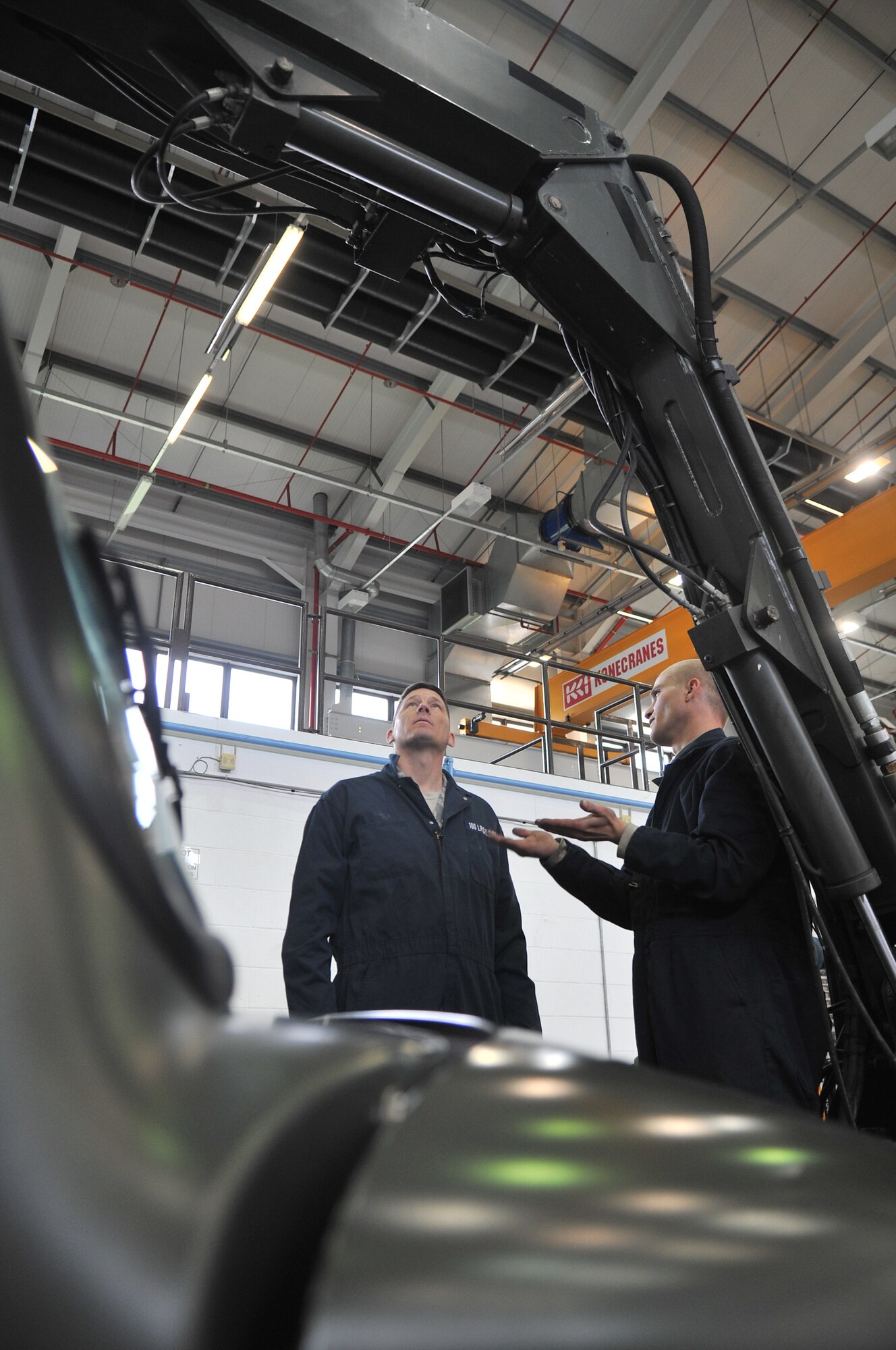 From left, Chief Master Sgt. Tracy Jones, 100th Air Refueling Wing command chief, and Senior Airman Kane Goligoski, 100th Logistics Readiness Squadron vehicle and vehicular equipment mechanic from Columbus, Georgia, inspect a global deicer’s hydraulics system May 15, 2013, on RAF Mildenhall, England. The global deicer is used to remove and prevent ice from forming on aircraft, making it essential to base flying operations during the winter months and freezing weather conditions. (U.S. Air Force photo by Senior Airman Jerilyn Quintanilla/Released) 