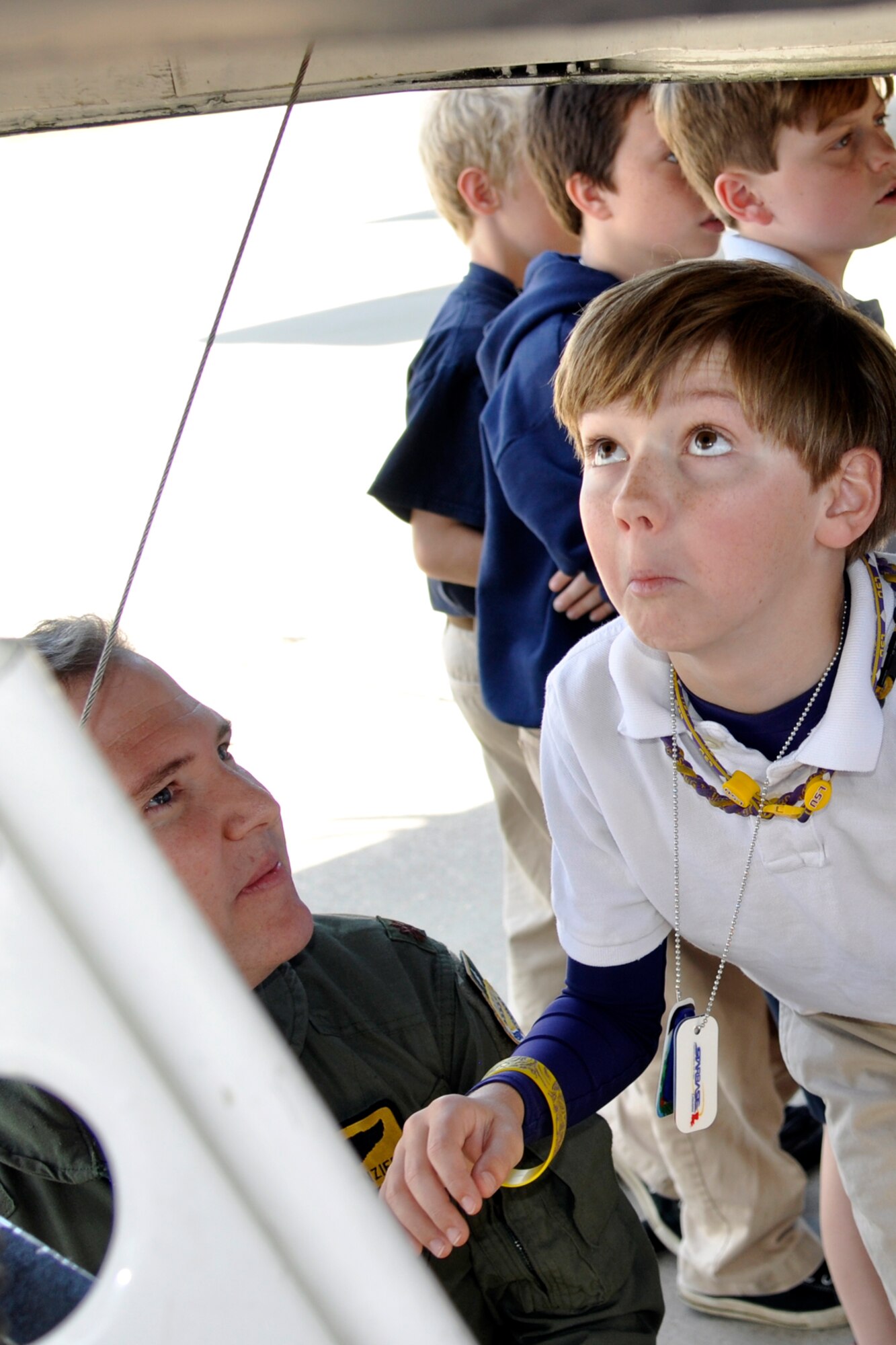 U.S. Air Force Maj. Brian Lanzieri, who is an instructor pilot at the 93rd Bomb Squadron’s Formal Training Unit, lets a school student get a look inside a B-52 Stratofortress during a static tour at Barksdale Air Force Base, La., May 14, 2013. The local 5th Grade students are attending STARBASE Louisiana, at Barksdale, one of 70 national STARBASE sites. The program is sponsored by the 307th Bomb Wing of the Air Force Reserve Command. STARBASE presents an exciting 25-hour hands-on minds-on Science, Technology, Engineering, and Mathematics (STEM) curriculum to area 5th grade students and their teachers. Approximately 90 students plus their teachers from Curtis and Benton Elementary Schools in Bossier Parish took part in the static tour. (US Air Force photo by Betty Stephens/Released)