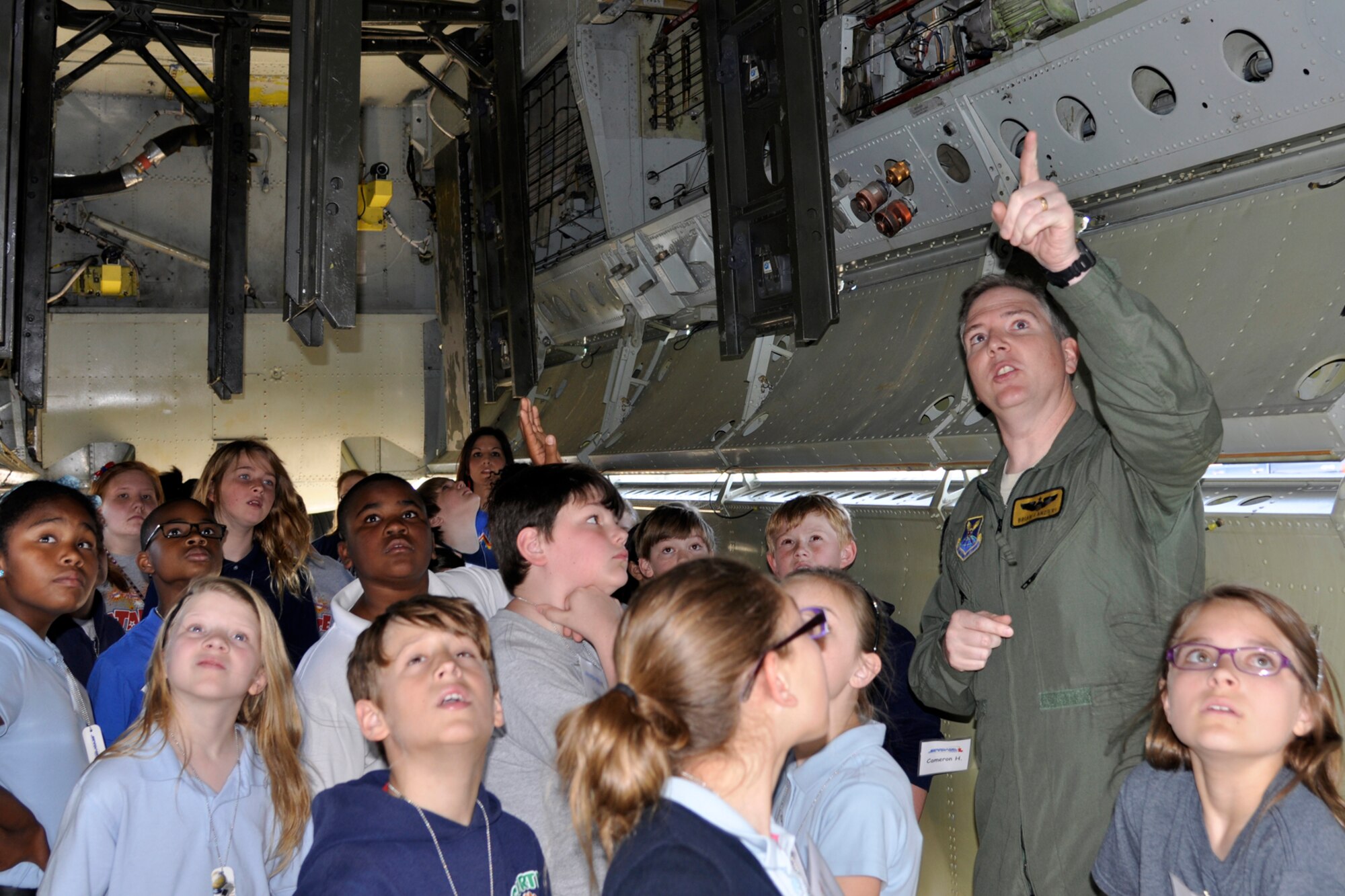 U.S. Air Force Maj. Brian Lanzieri, who is an instructor pilot at the 93rd Bomb Squadron’s Formal Training Unit, explains the war-time capabilities of a B-52 Stratofortress to a group of 5th grade students during a static tour at Barksdale Air Force Base, La., May 14, 2013. The students are attending STARBASE Louisiana, at Barksdale, one of 70 national STARBASE sites. It is sponsored by the 307th Bomb Wing of the Air Force Reserve Command. The program presents an exciting 25-hour hands-on minds-on Science, Technology, Engineering, and Mathematics (STEM) curriculum to area 5th grade students and their teachers. STARBASE Louisiana creates an environment to actively engage students in STEM exploration to excite their interest, develop a solid concept base, and encourage them to pursue these areas in future studies. Approximately 90 students from Curtis and Benton Elementary Schools in Bossier Parish took part in the static tour. (US Air Force photo by Betty Stephens/Released)