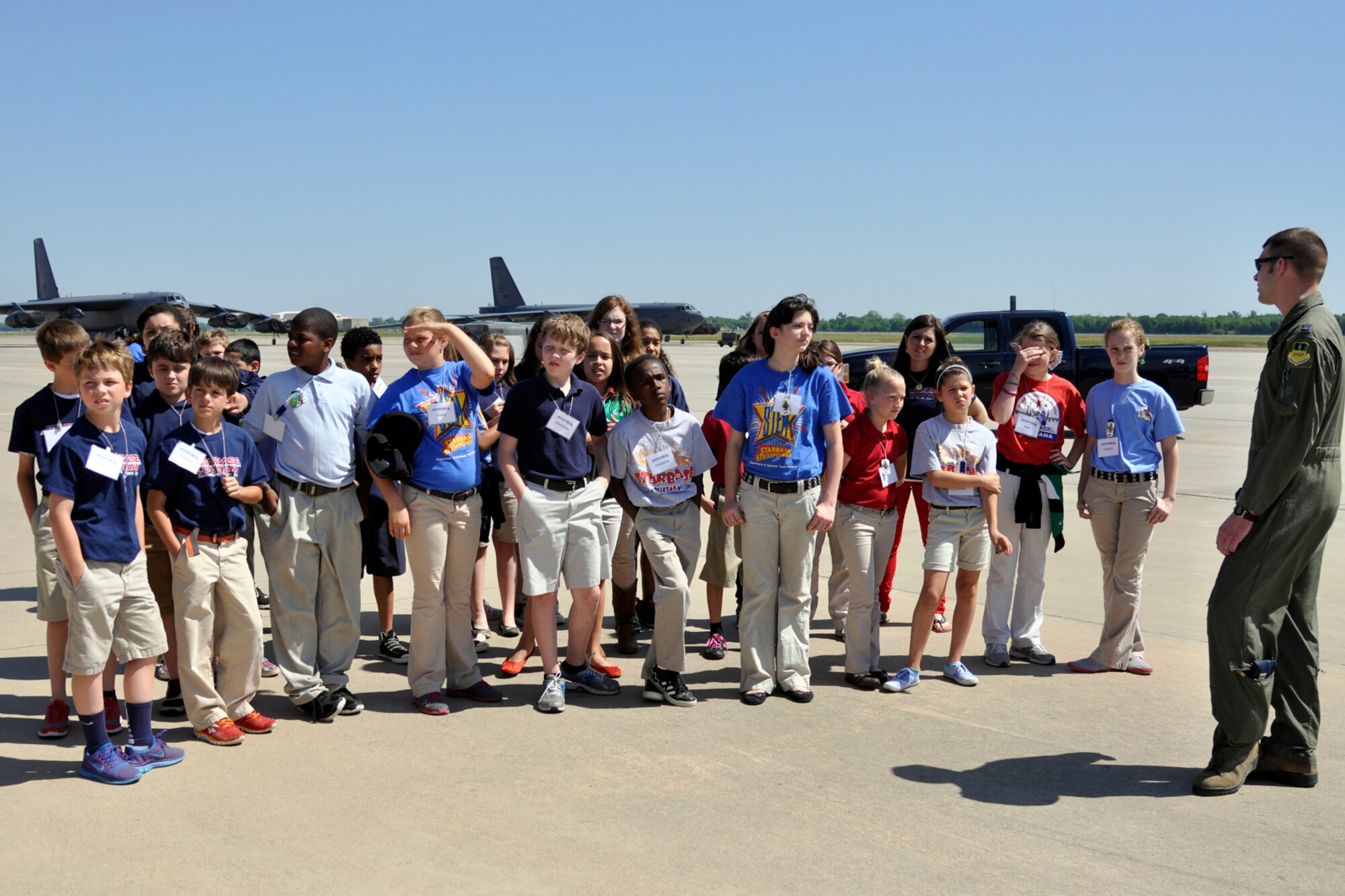 U.S. Air Force Capt. Jeff Vanderhyde, who is an instructor radar at the 93rd Bomb Squadron’s Formal Training Unit, answers questions about the B-52 Stratofortress from a group of STARBASE students at Barksdale Air Force Base, La., May 14, 2013. The local 5th Grade students are attending STARBASE Louisiana, at Barksdale, one of 70 national STARBASE sites. The program is sponsored by the 307th Bomb Wing of the Air Force Reserve Command. STARBASE presents an exciting 25-hour hands-on minds-on Science, Technology, Engineering, and Mathematics (STEM) curriculum to area 5th grade students and their teachers. Approximately 90 students and teachers from Curtis and Benton Elementary Schools in Bossier Parish took part in the static tour. (US Air Force photo by Betty Stephens/Released)
