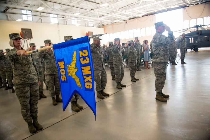 A formation of Airmen from the 23d Maintenance Operations Squadron salutes during the national anthem during the 23d MOS inactivation ceremony May 15, 2013, at Moody Air Force Base, Ga. The unit’s roots began as the 23d Station Complement Squadron when it was constituted 70 years ago on May 15, 1943. (U.S. Air Force photo by Staff Sgt. Jamal D. Sutter/Released)
