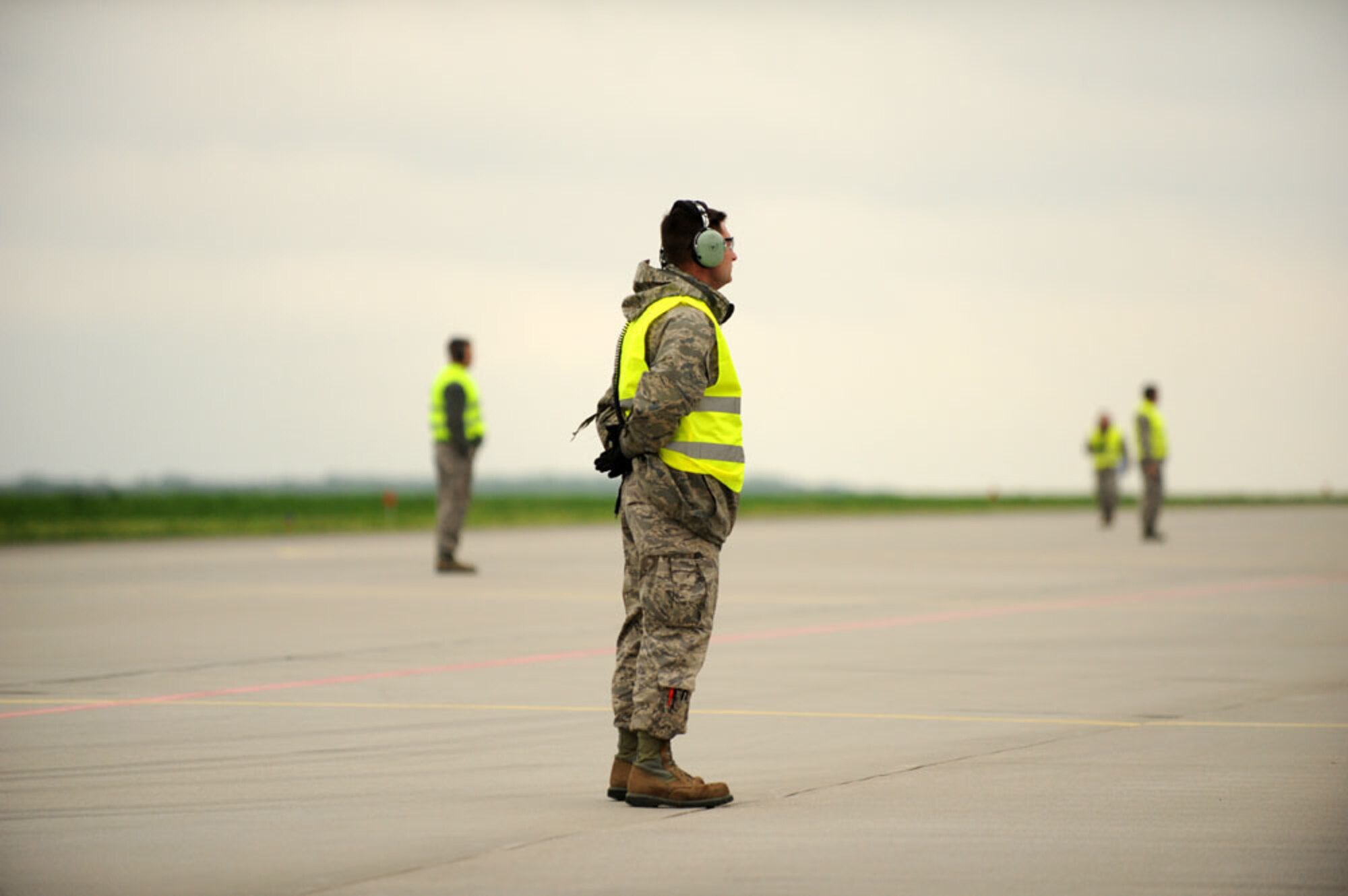 LASK AIR BASE, Poland — U.S. Air Force Tech. Sgt. David Bizefski, 115th Aircraft Maintenance Squadron, Wisconsin Air National Guard, awaits the launch of a U.S. Air Force F-16 Fighting Falcon fighter aircraft during the first mission of Aviation Detachment Rotation 13-2, a joint theater security cooperation event.  U.S. and Polish air force F-16s, along with MiG-29s and Su-22s will conduct simulated air combat scenarios with both nations' forces working toward a common objective. (U.S. Air Force photo by Tech. Sgt. Kenya Shiloh/released)