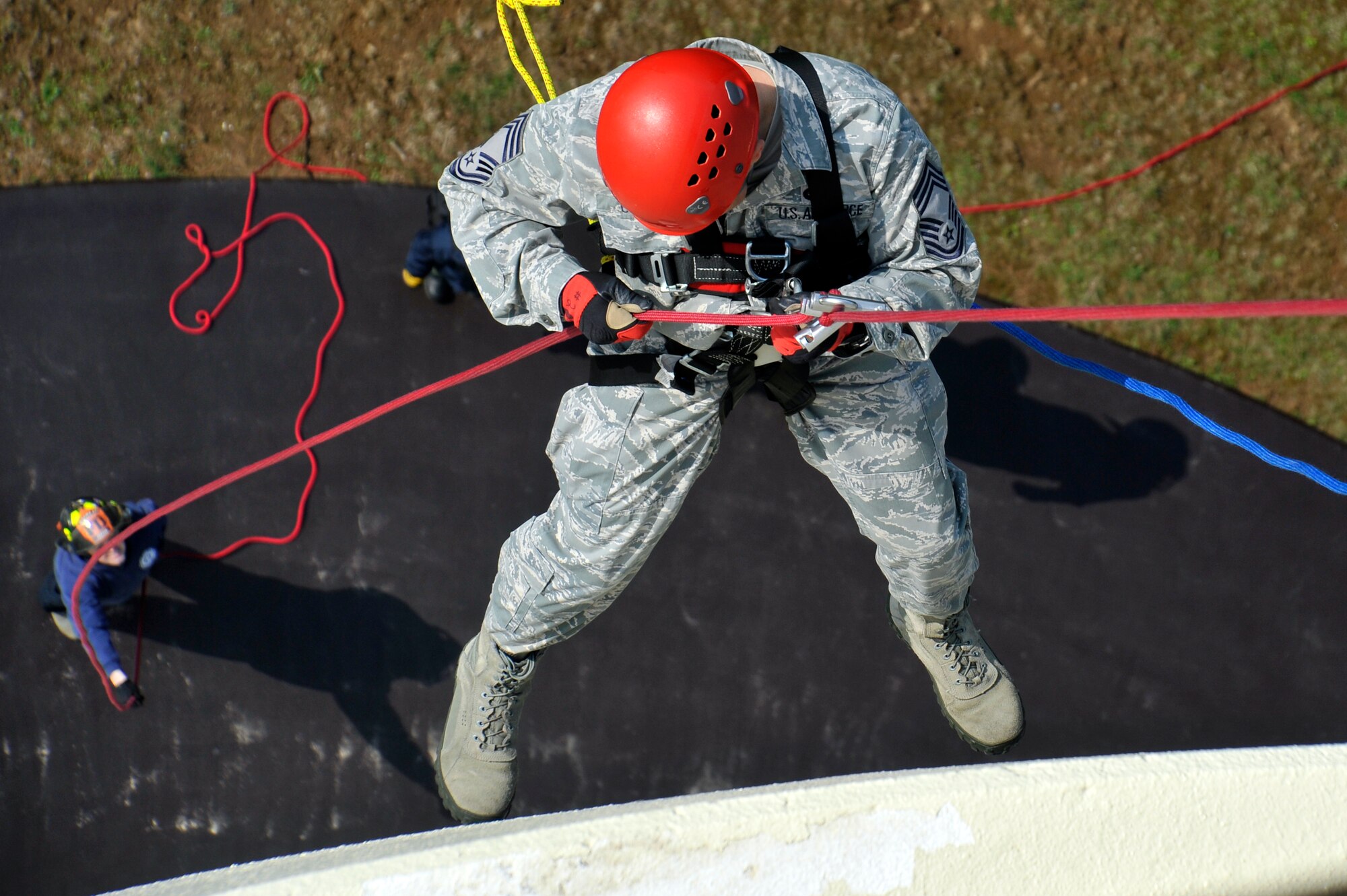 U.S. Air Force Chief Master Sgt. Clifford Ocampo, 35th Fighter Wing acting command chief, rappels off a water tower during warrior day rappel training at Misawa Air Base, Japan, May 10, 2013. Members of the 35th Civil Engineer Squadron fire department gave instructions on how to properly rappel to Ocampo and other members of base leadership during their monthly warrior day training. (U.S. Air Force photo by Airman 1st Class Zachary Kee) 