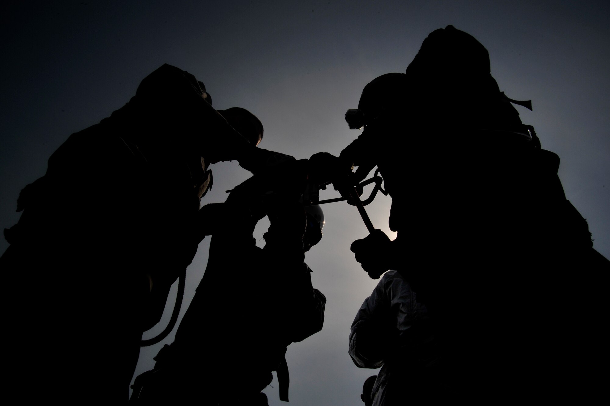 Members of the 35th Civil Engineer Squadron fire department prepare the ropes and brake bar for rappel training at Misawa Air Base, Japan, May 10, 2013. Members of the 35 CES fire department complete rappel training to become certified to perform rope and high-angle rescue techniques. (U.S. Air Force photo by Airman 1st Class Zachary Kee) 