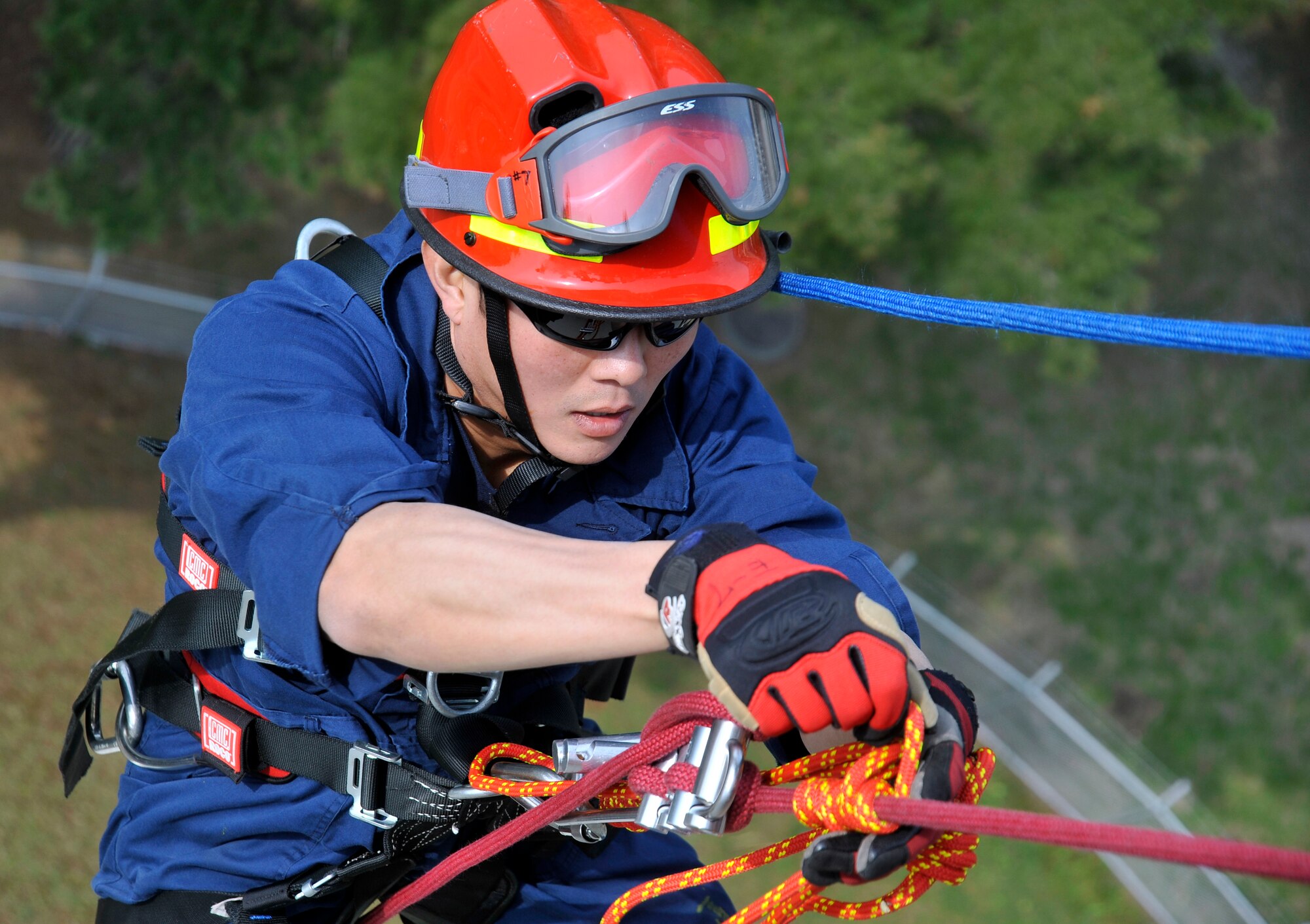 U.S. Air Force Staff Sgt. Jason Kawaguchi, 35th Civil Engineer Squadron firefighter, prepares to rappel down a water tower during rappel training at Misawa Air Base, Japan, May 10, 2013. Members of the 35 CES fire department use this kind of training for confined space entry and high-angle rescue situations. (U.S. Air Force photo by Airman 1st Class Zachary Kee)