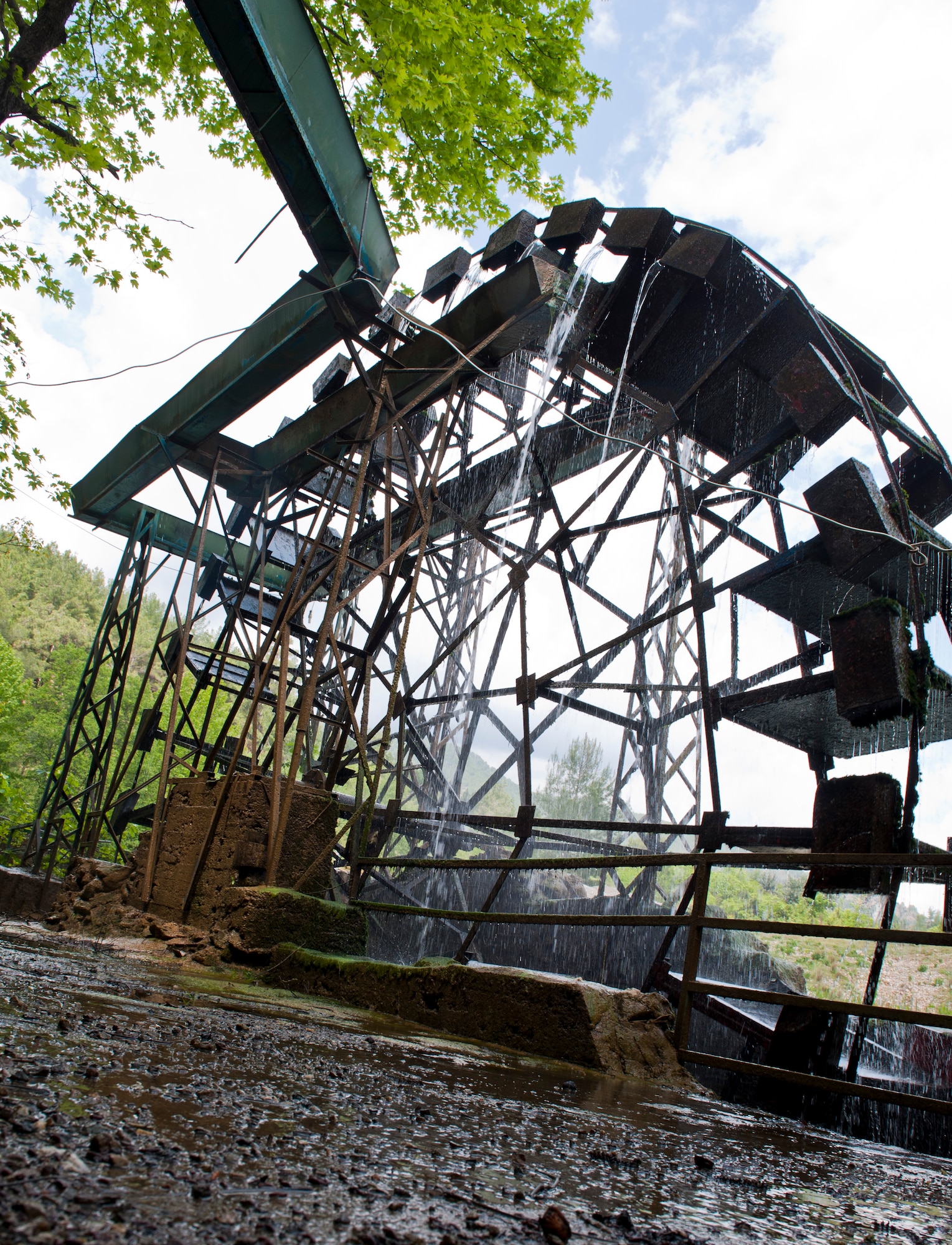 A water wheel pulls water from a river to transfer it into different station at a trout farm April 20, 2013, in the Mersin Province, Turkey. The trout farm was a final stop during an 39th Force Support Squadron Outdoor Recreation trip to visit Mamure Castle. (U.S. Air Force photo by Senior Airman Daniel Phelps/Released)