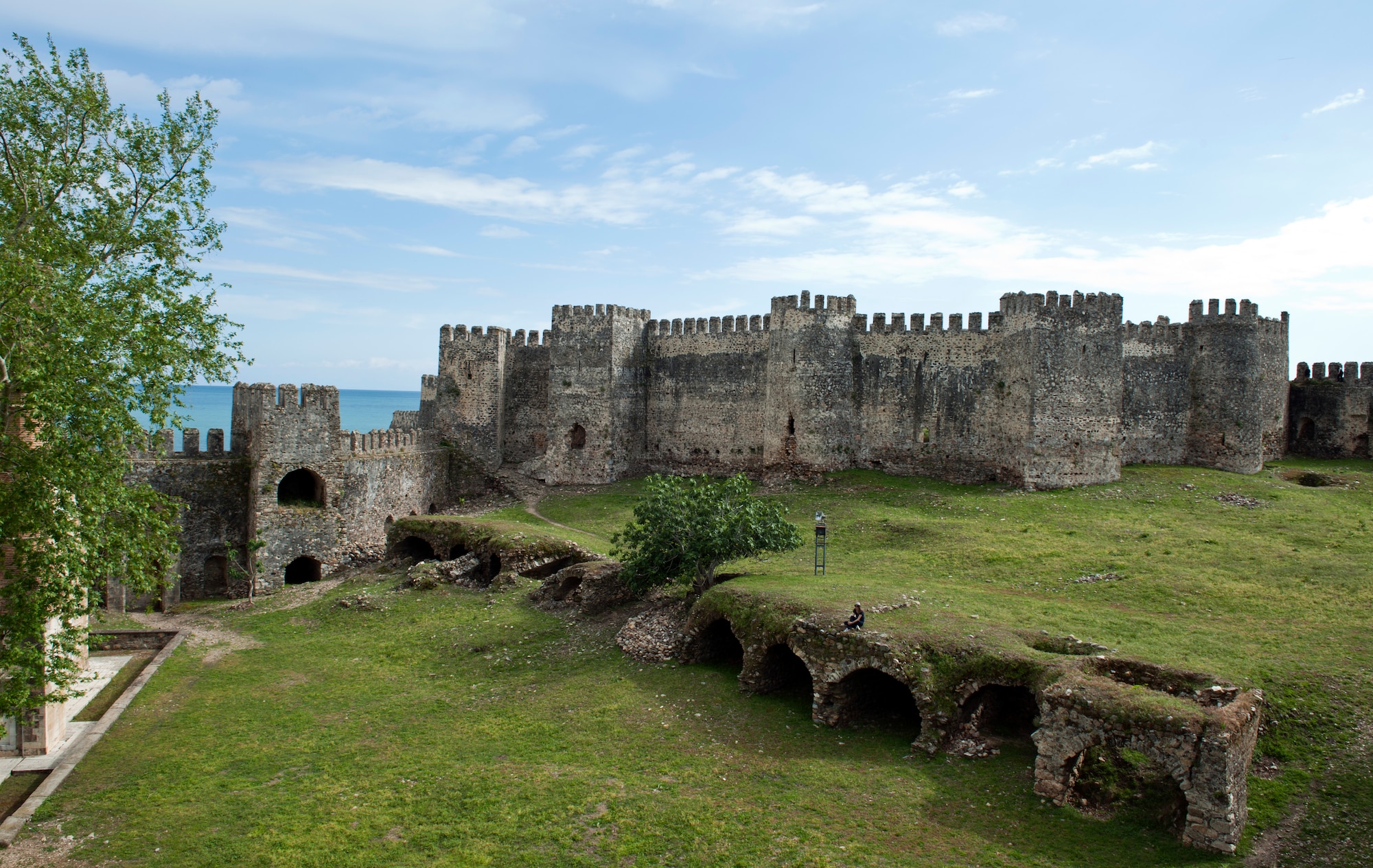 A Turkish girl relaxes in one of the three courtyards inside Mamure Castle April 20, 2013, at Anamur, Turkey. The 253,000-square-foot castle is surrounded by a moat and has 39 towers and bastions. (U.S. Air Force photo by Senior Airman Daniel Phelps/Released)