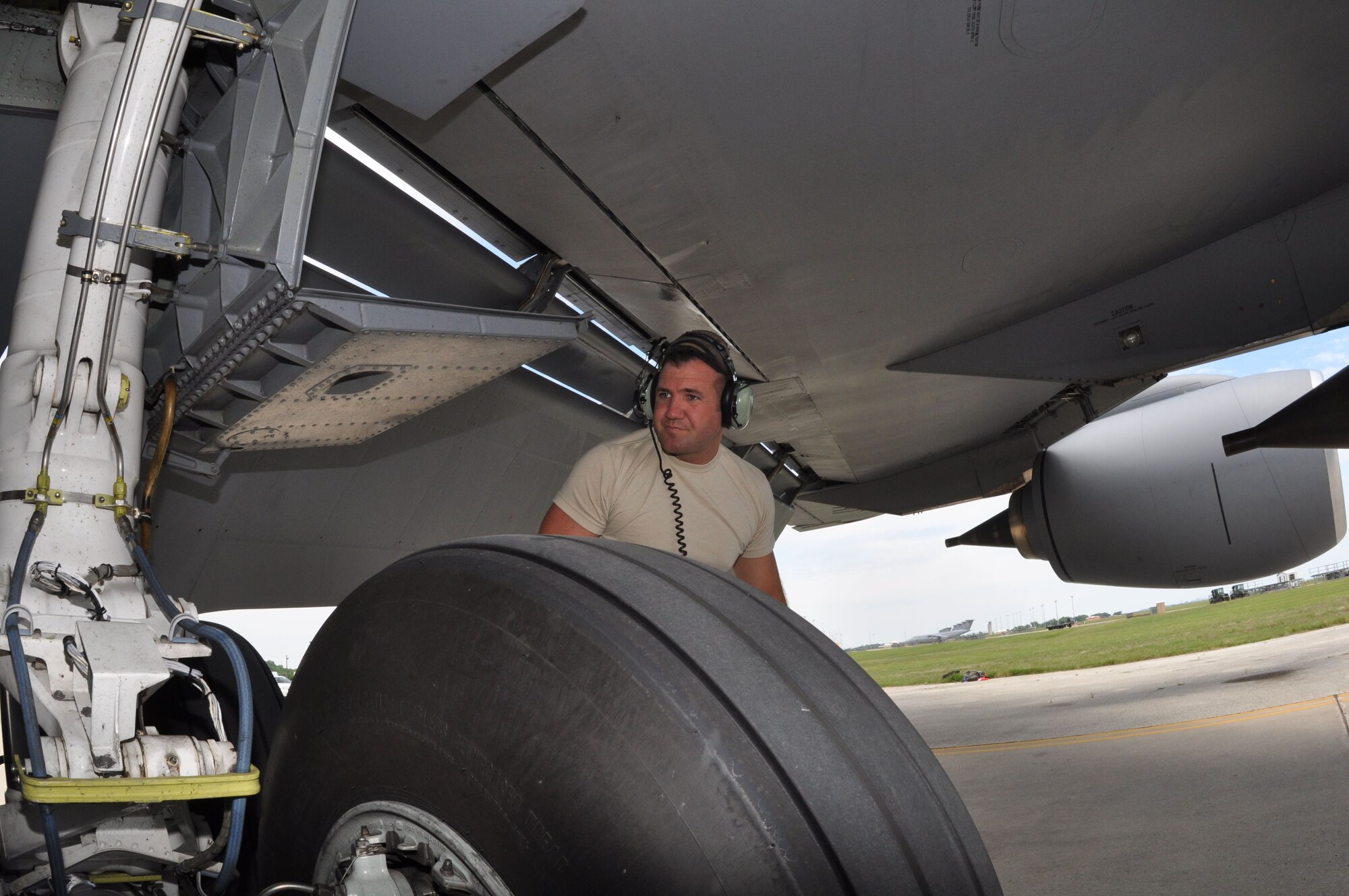 Tech Sgt. Scott Perkins, a crew chief with the 931st Aircraft Maintenance Squadron, looks over the landing gear of a KC-135 Stratotanker at Joint Base San Antonio-Lackland, May 12. (Air Force photo by Master Sgt. Brannen Parrish)