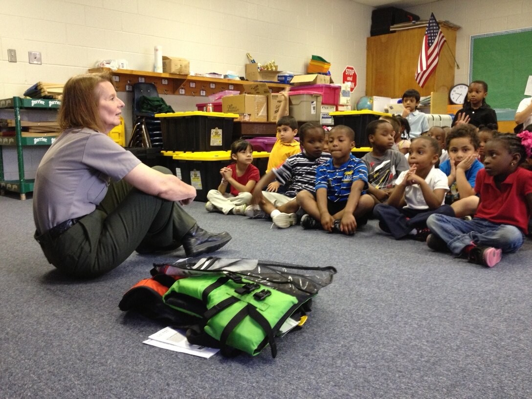 Outdoor Recreation Planner Chris Smith from the Little Rock District sits with pre-k and kindergarten students from Carver Magnet Elementary School in Little Rock, Ark. for the school’s annual career day on May 15. Smith visited with 125 students from pre-k to fifth-grade telling them how cool her job was and how to pursue a career with the Corps in the future. “I’ve been with the Corps for 34 years and I’ve been wearing this uniform the whole time, well… not this exact uniform but one like it,” Smith said to get a laugh from the students. Smith used her time to focus on water safety while Public Affairs Specialist Jay Townsend talked about the district’s past,  present and how the students could be part of the Corps’ future all while stressing the importance of science, technology, engineering and mathematics. Carver Magnet offers a full-range curriculum, with a focus on science and math that equips children at an early age with the academic and social skills to live in a technical world.
