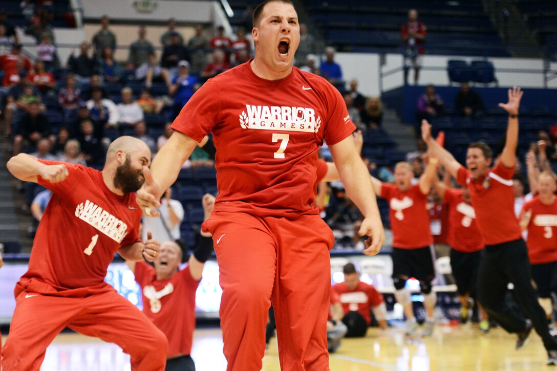 Marine Corps Lance Cpl. Brandon Malone reacts to the Marines winning the gold medal in sitting volleyball at the 2013 Warrior Games in Colorado Springs, Colo., May 15, 2013.