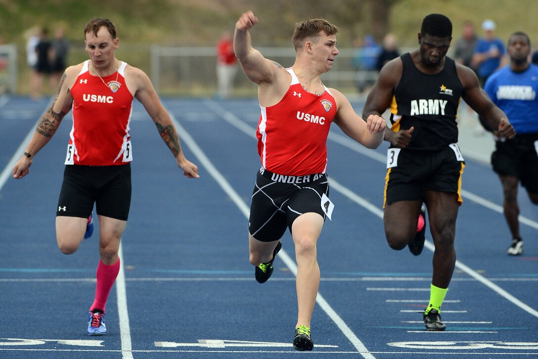 Marine Corps Cpl. Kyle Reid wins the men's 200-meters open race during the 2013 Warrior Games track and field competition in Colorado Springs, Colo., May 14, 2013. More than 200 wounded, ill, and injured service members and veterans will compete in the games, which run through May 16. The military service with the most medals will win the Chairman's Cup.