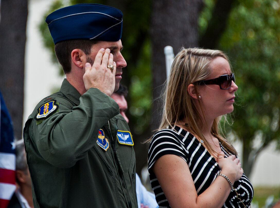 Maj. Stephen Barber, an officer with the 728th Air Control Squadron, salutes during the National Anthem at the Griffin Memorial Rededication Ceremony May 16 at Eglin Air Force Base, Fla.  Staff Sgt. Patrick Griffin, a member of the 728th ACS, was the only Eglin casualty of Operation Iraqi Freedom when he was killed by a roadside bomb May 13, 2003.  His memorial was moved from the 728th ACS building, which will be deactivated May 17, to its new location close to the 33rd Fighter Wing’s Khobar Towers Memorial.  (U.S. Air Force photo/Samuel King Jr.)