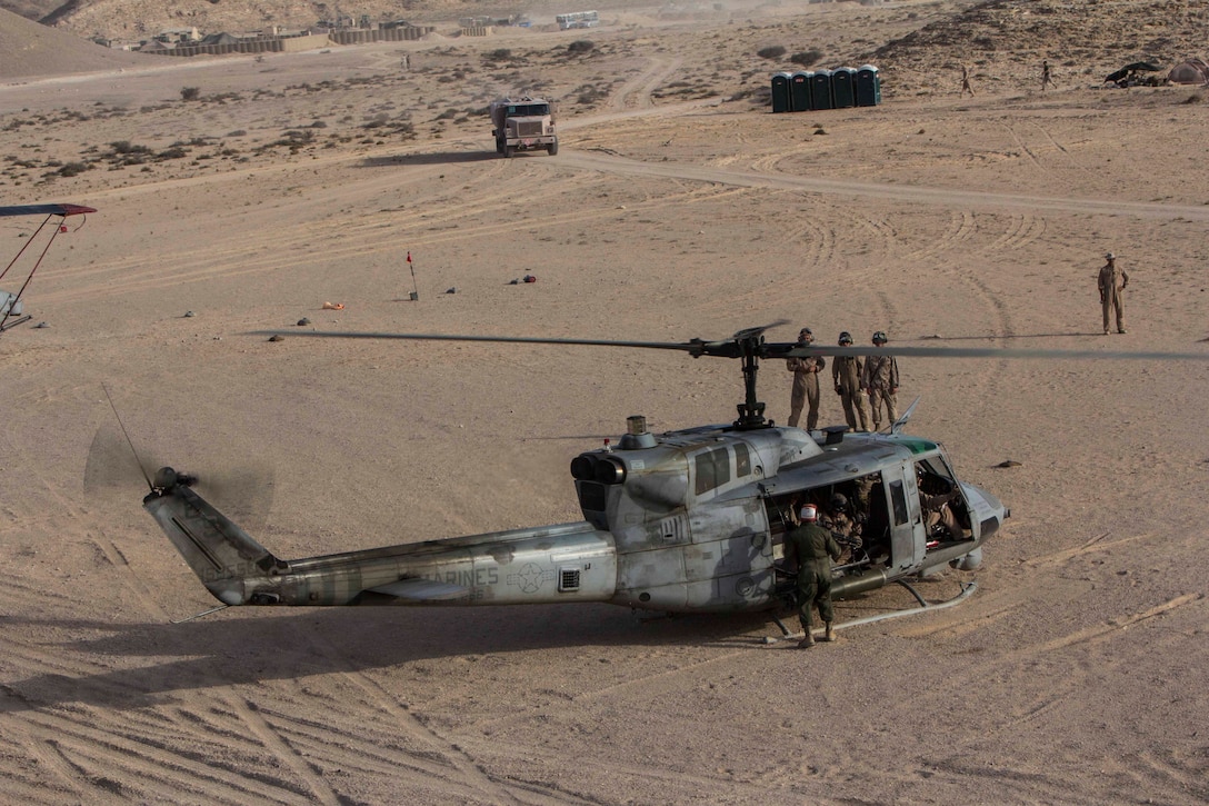 A UH-1N Huey gunship assigned to Marine Medium Tiltrotor Squadron (VMM) 266 (Reinforced), 26th Marine Expeditionary Unit (MEU) lands at  a forward arming and refueling point during an exercise in the 5th Fleet area of responsibility, April 29, 2013. The 26th MEU is currently deployed as part of the Kearsarge Amphibious Ready Group to the 5th Fleet area of responsibility. The 26th MEU operates continuously across the globe, providing the president and unified combatant commanders with a forward-deployed, sea-based quick reaction force. The MEU is a Marine Air-Ground Task Force capable of conducting amphibious operations, crisis response, and limited contingency operations.
(U.S. Marine Corps photo by Cpl. Michael S. Lockett/Released)
