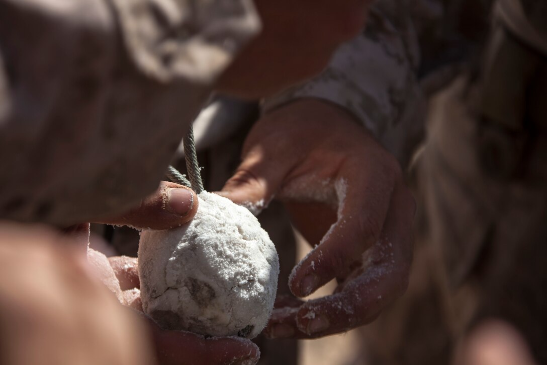 Marines assigned to the 26th Marine Expeditionary Unit (MEU) prepare Composition C-4 before conducting a demolitions range during an exercise in the 5th Fleet area of responsibility April 29, 2013. The 26th MEU is currently deployed as part of the Kearsarge Amphibious Ready Group to the 5th Fleet area of responsibility. The 26th MEU operates continuously across the globe, providing the president and unified combatant commanders with a forward-deployed, sea-based quick reaction force. The MEU is a Marine Air-Ground Task Force capable of conducting amphibious operations, crisis response, and limited contingency operations.
(U.S. Marine Corps photo by Staff Sgt. Edward Guevara/Released)