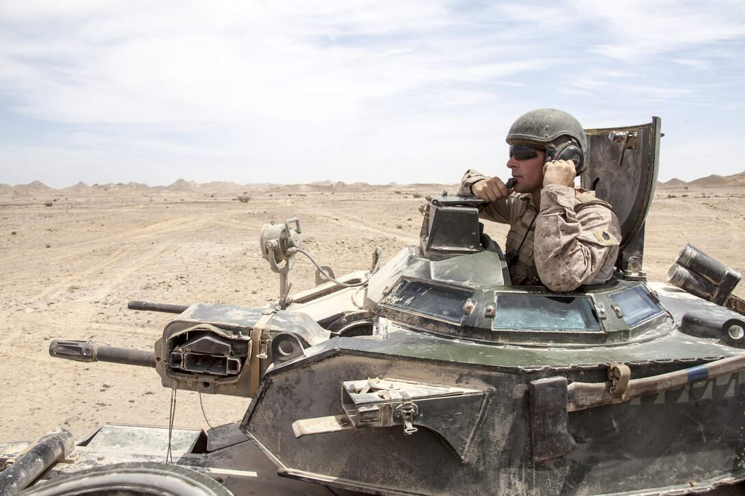 Staff Sgt. Tom Painter, from Roanoke, Va., and section leader, Amphibious Assault Vehicle (AAV) Platoon, Battalion Landing Team 3/2, 26th Marine Expeditionary Unit (MEU), provides transportation and protection at a demolitions range during an exercise in the 5th Fleet area of responsibility April 29, 2013. The 26th MEU is currently deployed as part of the Kearsarge Amphibious Ready Group to the 5th Fleet area of responsibility. The 26th MEU operates continuously across the globe, providing the president and unified combatant commanders with a forward-deployed, sea-based quick reaction force. The MEU is a Marine Air-Ground Task Force capable of conducting amphibious operations, crisis response, and limited contingency operations.
(U.S. Marine Corps photo by Staff Sgt. Edward Guevara/Released)