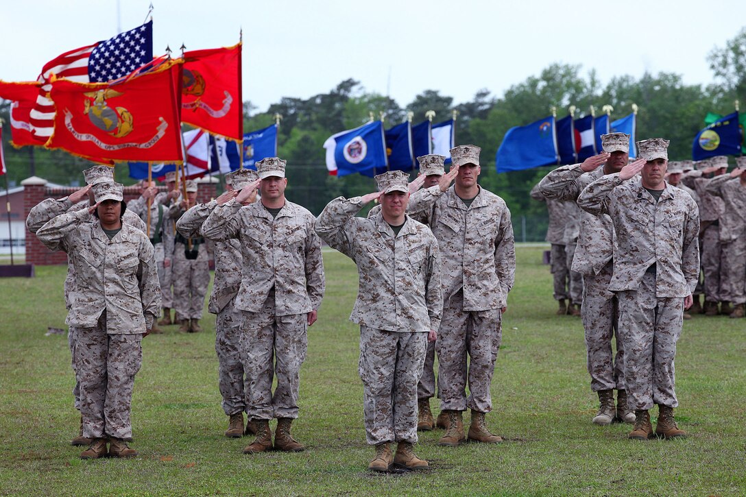 Col. Archibald M. McLellan, and Col. Jeffrey W. Fultz congratulate each other during the Change of Command ceremony at Stone Bay aboard Camp Lejeune. Fultz relinquished command to McLellan on May 2nd.