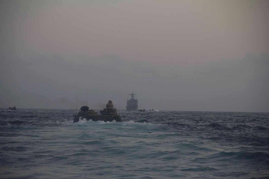 Marines of Amphibious Assault Vehicle Platoon, Battalion Landing Team 3/2, 26th Marine Expeditionary Unit (MEU), hit the ocean in their vehicles to return to the USS Carter Hall (LSD 50) at the conclusion of a training exercise in the 5th Fleet area of responsibility May 4, 2013. The 26th MEU is currently deployed as part of the Kearsarge Amphibious Ready Group to the 5th Fleet area of responsibility. The 26th MEU operates continuously across the globe, providing the president and unified combatant commanders with a forward-deployed, sea-based quick reaction force. The MEU is a Marine Air-Ground Task Force capable of conducting amphibious operations, crisis response, and limited contingency operations.
(U.S. Marine Corps photo by Cpl. Michael S. Lockett/Released)
