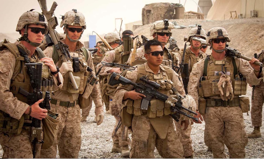 U.S. Marines and Sailors with Weapons Company, 2nd Battalion 9th Marines, Regimental Combat Team 7, wait out a dust storm on Camp Bastion, Helmand province, Afghanistan, April 15, 2013.