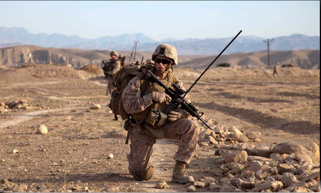 U.S. Marine Corps Capt. Paul Gates, commanding officer, Weapons Company, 3rd Battalion, 4th Marine Regiment, pauses during a dismounted patrol with Afghan National Civil Order Policemen during Operation California in Kajaki district, Helmand province, Afghanistan, April 28, 2013.