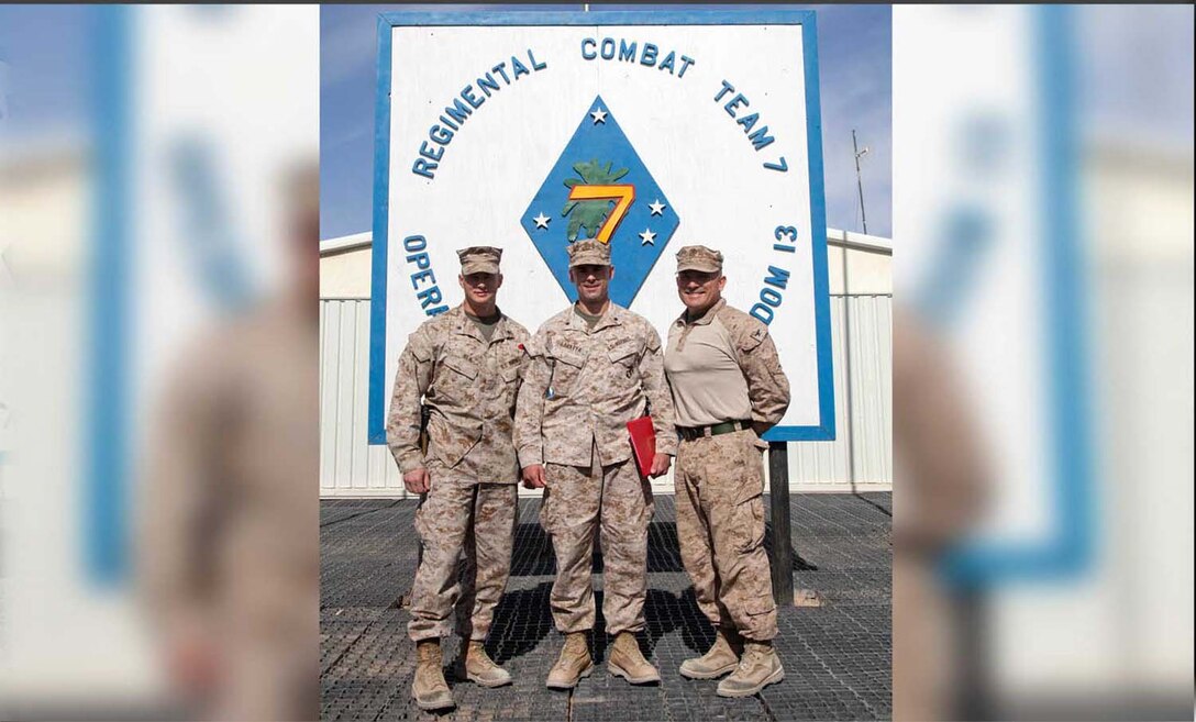 U.S. Marine Corps Lt. Col. Brian Neil, Lt. Col. Vincent Laratta and Col. Austin E. Renforth, Regimental Combat Team 7 pose for a group photo on Camp Leatherneck, Helmand province, Afghanistan, May 1, 2013.