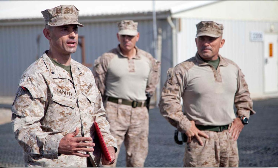 U.S. Marine Corps Lt. Col. Vincent Laratta addresses fellow Marines and Sailors assigned to Headquarters Company, Regimental Combat Team 7 following promotion to his current rank on Camp Leatherneck, Helmand province, Afghanistan, May 1, 2013.