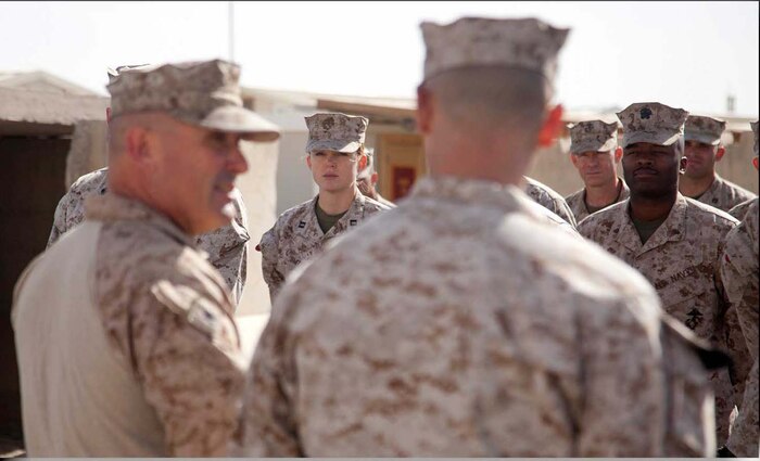U.S. Marines and Sailors assigned to Headquarters Company, Regimental Combat Team 7 stand in formation during a promotion ceremony on Camp Leatherneck, Helmand province, Afghanistan, May 1, 2013.