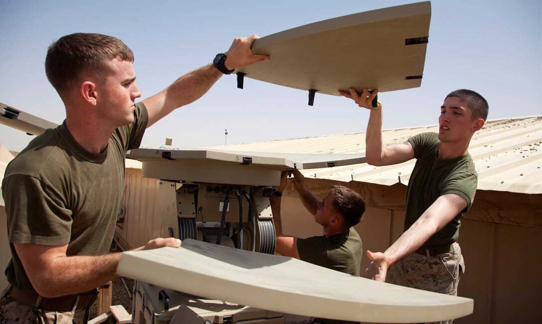 U.S. Marines assigned to Headquarters Company, Regimental Combat Team 7 set up Secure Internet Protocol and Nonsecure Internet Protocol Router Access Point (SNAP) satellite communications system on Camp Leatherneck, Helmand province, Afghanistan, April 24, 2013.