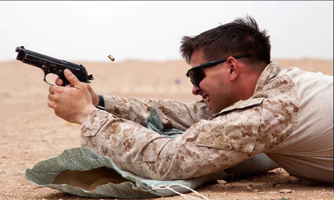 U.S. Marine Corps Cpl. Jared Bailey, from Higden, Ark., assigned to Afghan National Civil Order Police Kandak 1 Advisor Team, Regimental Combat Team 7, conducts small arms live fire training on Camp Leatherneck, Helmand province, Afghanistan, April 25, 2013.