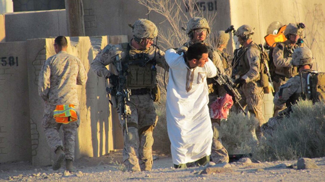 May 6, 2013: Marines with Maritime Raid Force, 13th Marine Expeditionary Unit, transport a mock-high value individual as part of an exercise on Fort Irwin, National Training Center, Calif., during Ground Realistic Urban Training. 