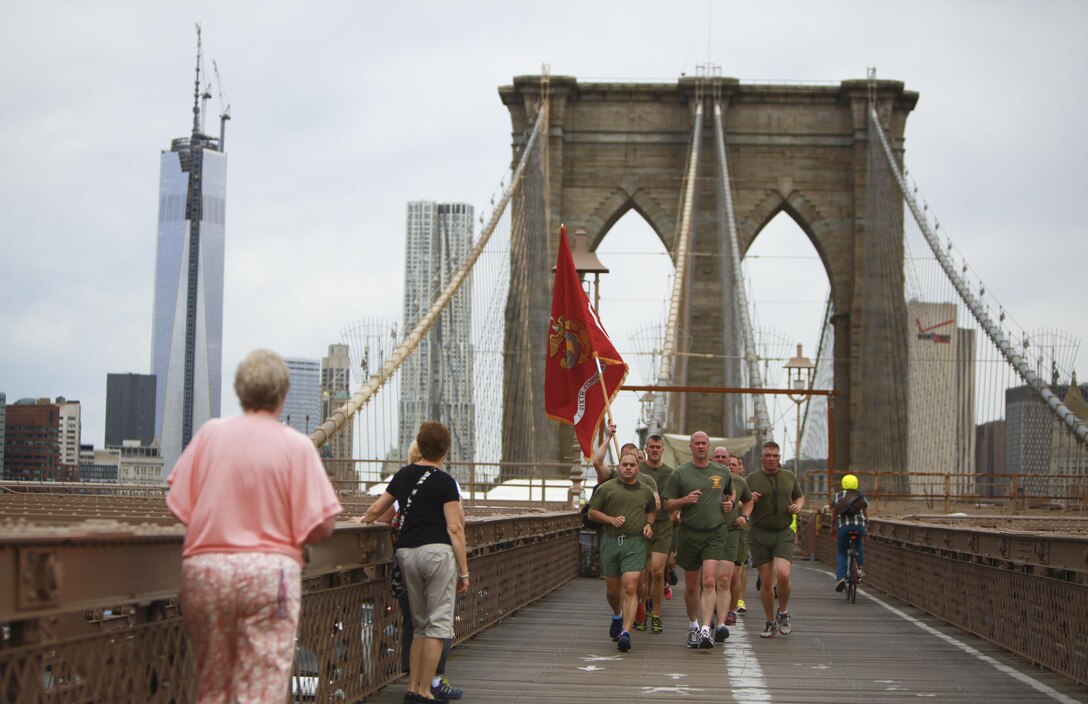 Marines with 6th Communication Battalion run and call cadence during an all-hands formation run over the Brooklyn Bridge from Manhattan, May 17.  The battalion conducted a four-mile run to enhance the Marines’ physical fitness, camaraderie and unit cohesion.  (U.S. Marine Corps photo by Sgt. Caleb Gomez).