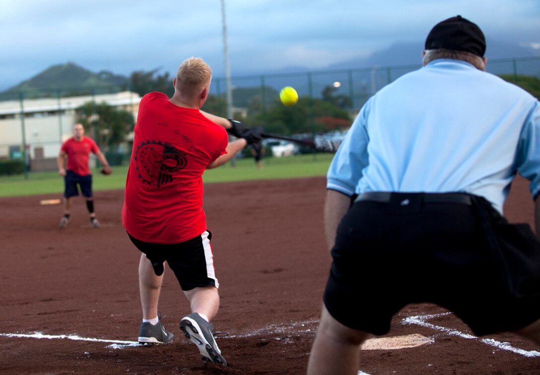 MARINE CORPS BASE HAWAII - Marine Light Attack Helicopter Squadron 367 Scarface player Kristopher Ammons prepares to hit the ball during an intramural softball league game against the Marine Aviation Logistics Squadron 24 Warriors at Annex Field, May 14, 2013. (U.S. Marine Corps photo by Nathan Knapke)