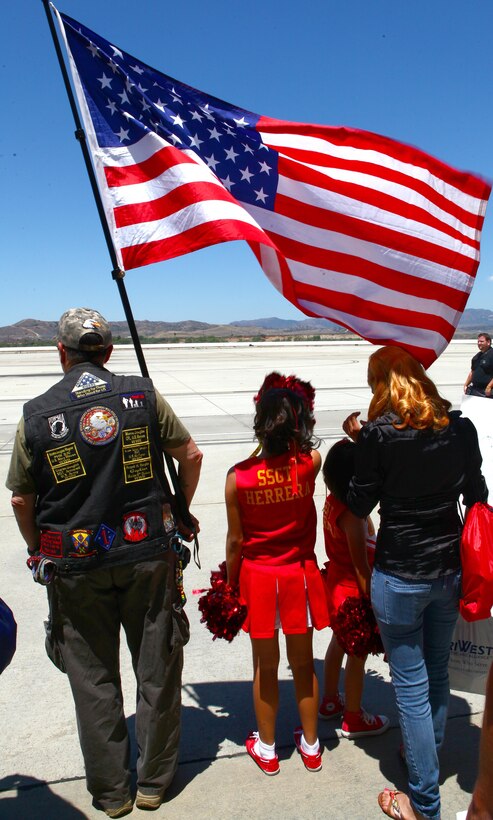 Precious Baltazar, 9 years old, waits for her father to return during a homecoming ceremony aboard Marine Corps Air Station Camp Pendleton, Calif., May 13. Her father returned with the rest of the Marine Medium Helicopter Squadron 364 "Purple Foxes" after an eight-month deployment with the 15th Marine Expeditionary Unit.